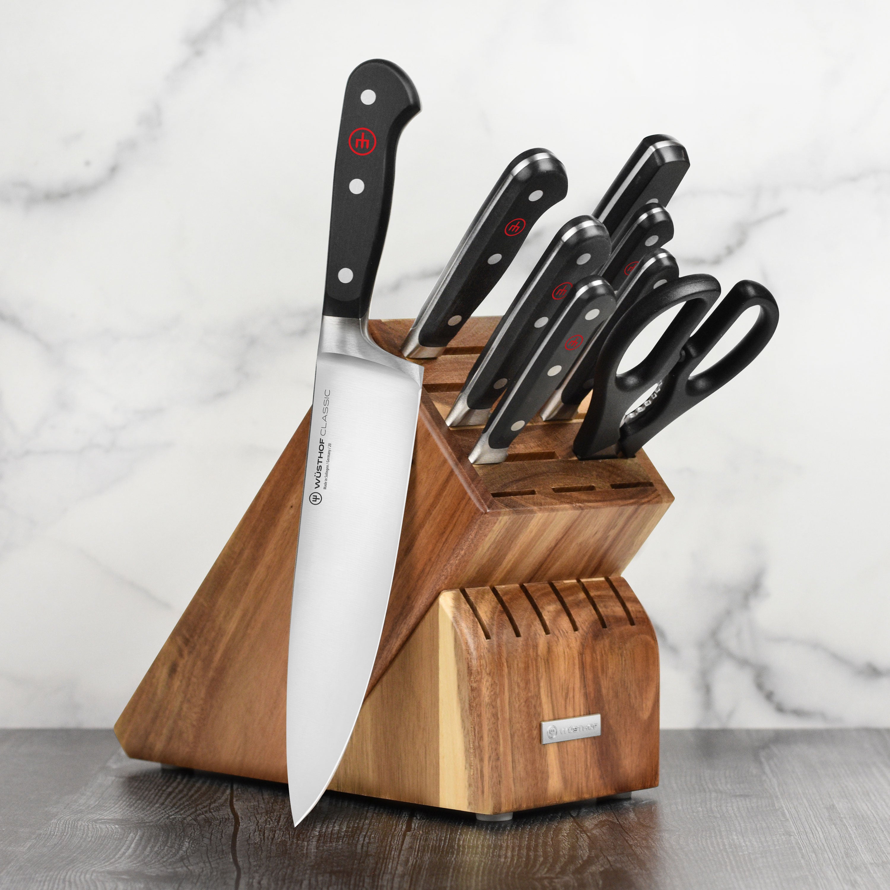 Wusthof Classic 9-Piece Knife Set with acacia block, displaying stainless steel blades and ergonomic handles.