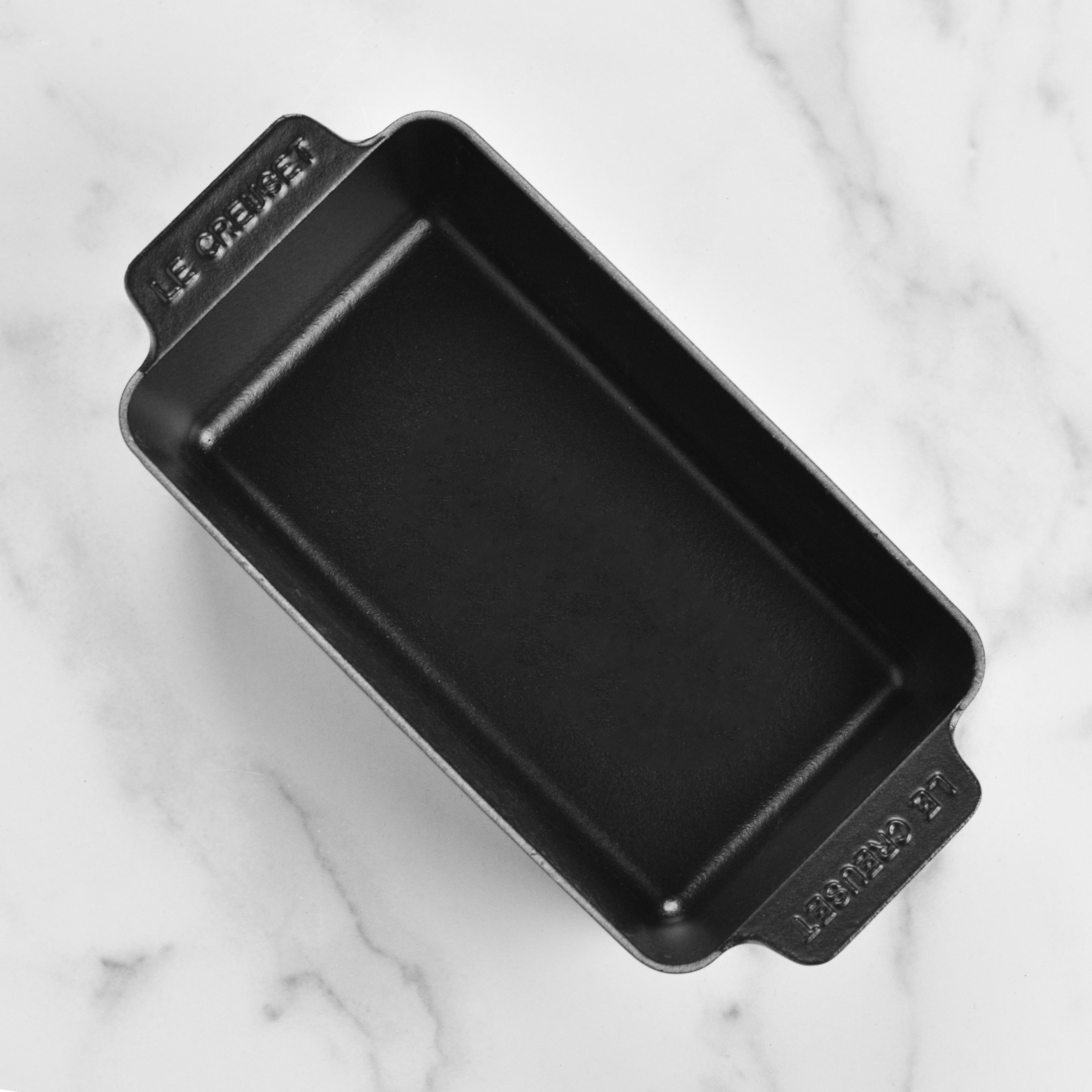 Loaf pan on oven rack with handles ready for transfer or serving