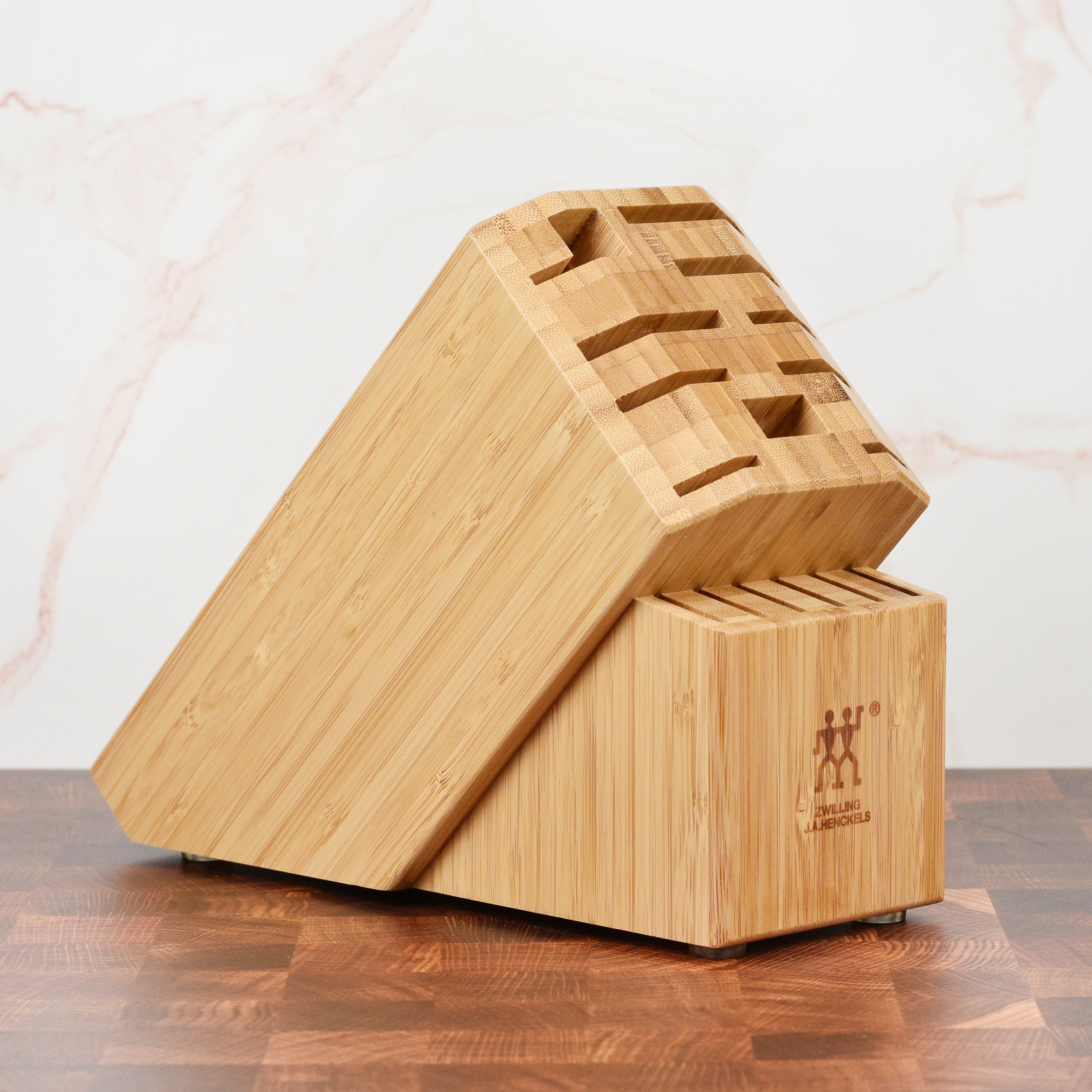 Front view of Zwilling Pro bamboo knife block showing the 16 knife slots, ideal for kitchen storage.