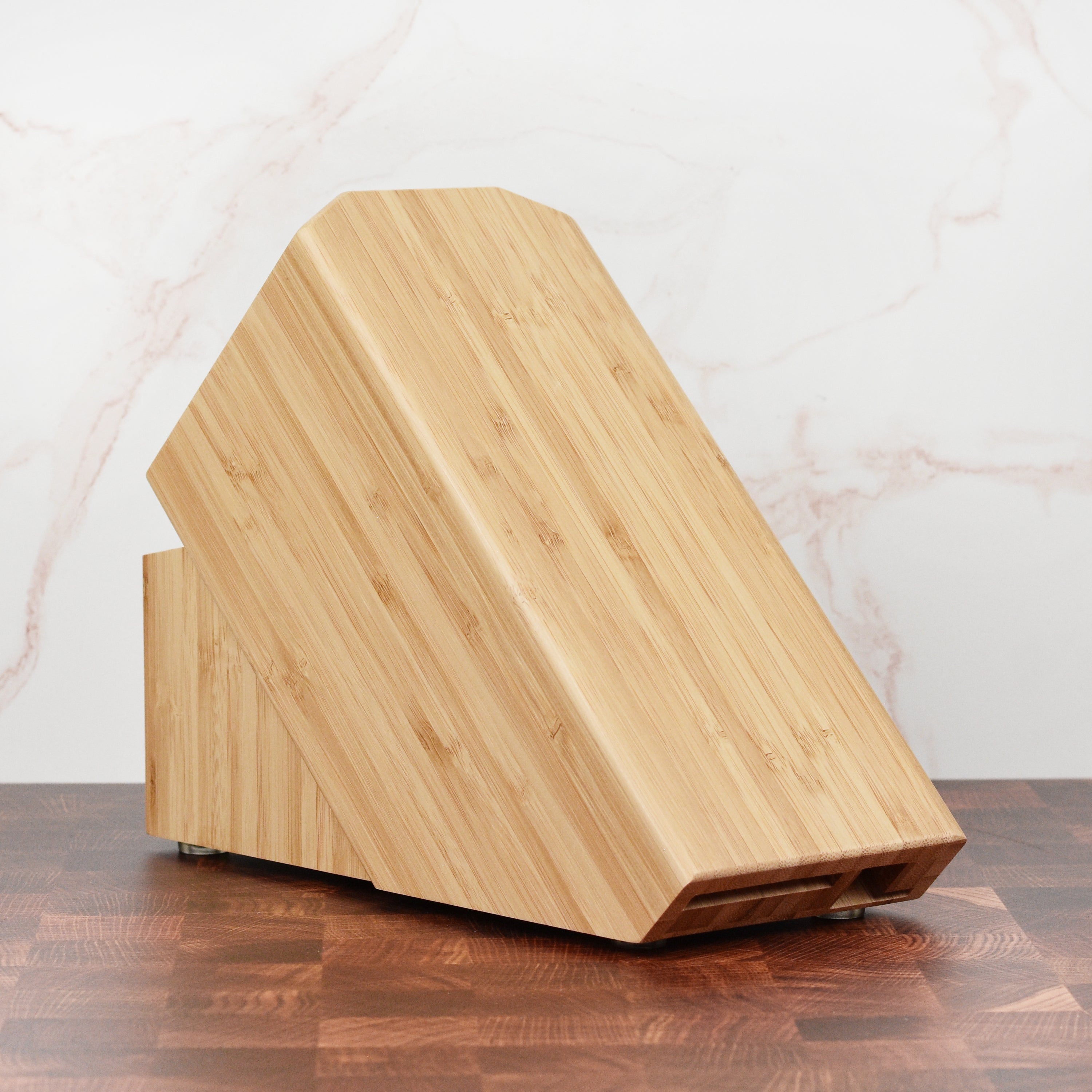 Close-up of the Zwilling Pro Bamboo Knife Block with knives securely placed, demonstrating the safety design.