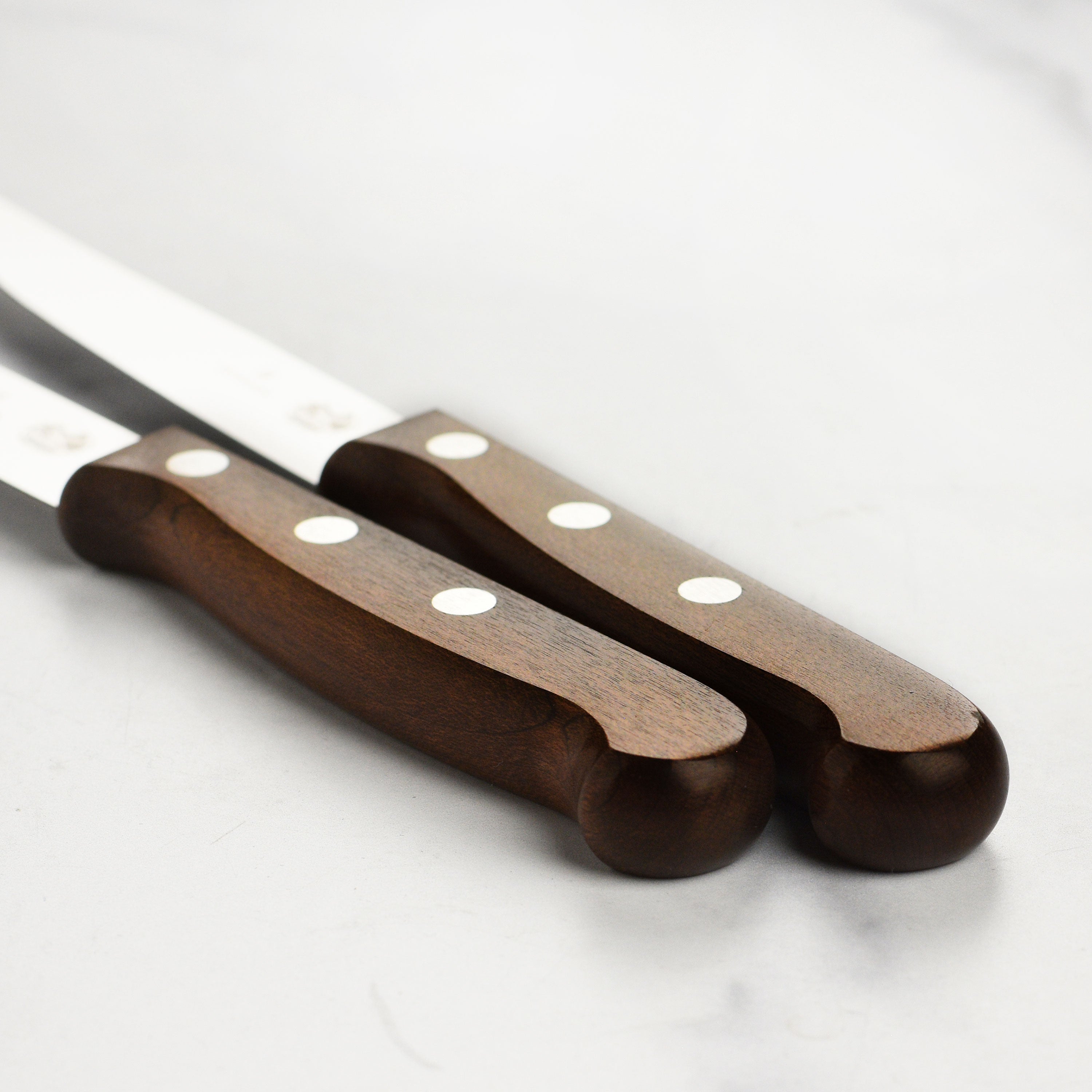 Close-up of the Victorinox Luxury Steak Knife Set showcasing fine craftsmanship and sharp blades.