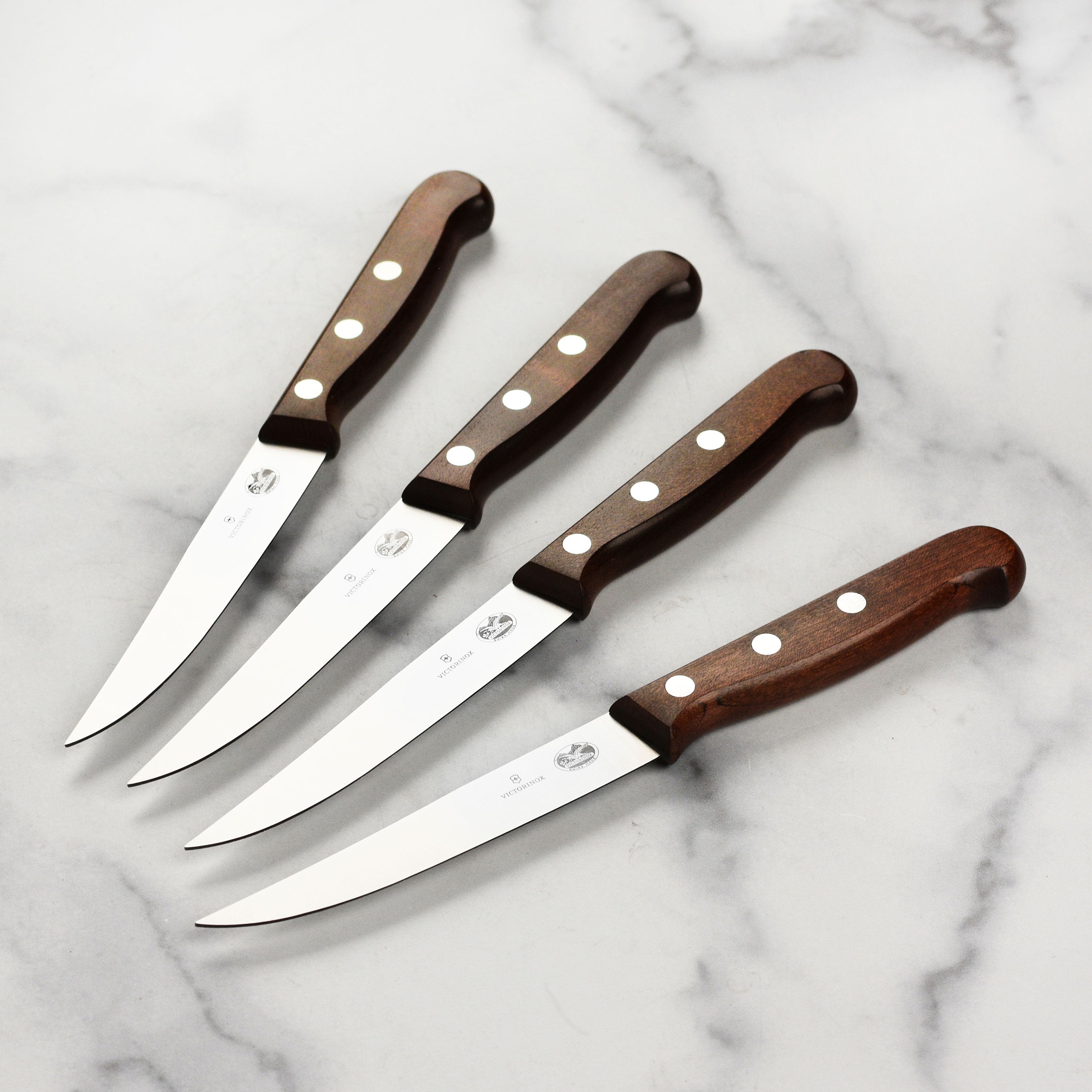 Victorinox steak knives with wooden handles and sharp blades for fine slicing