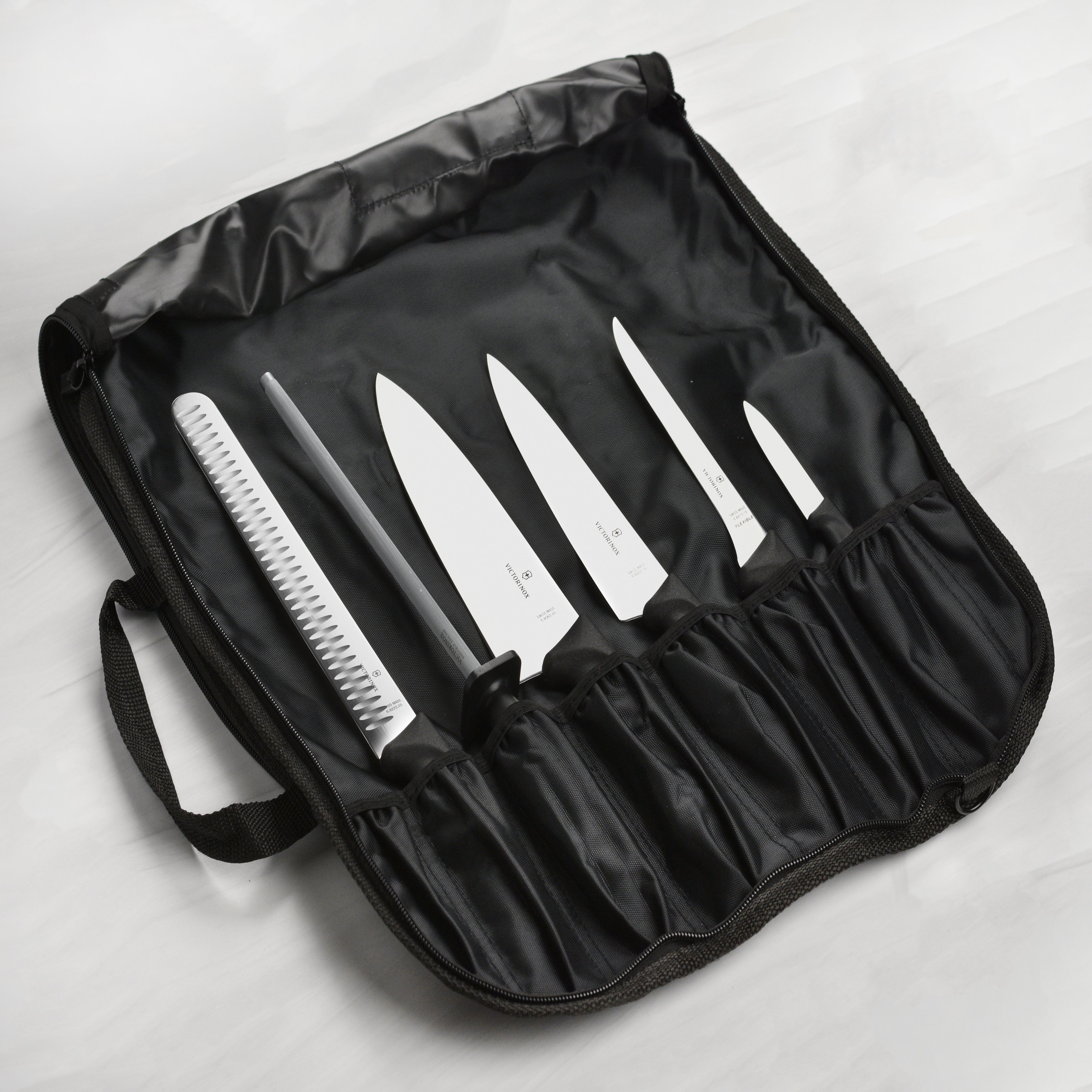 Close-up of the Swiss Precision BBQ knives showcasing the high-carbon stainless steel blades.