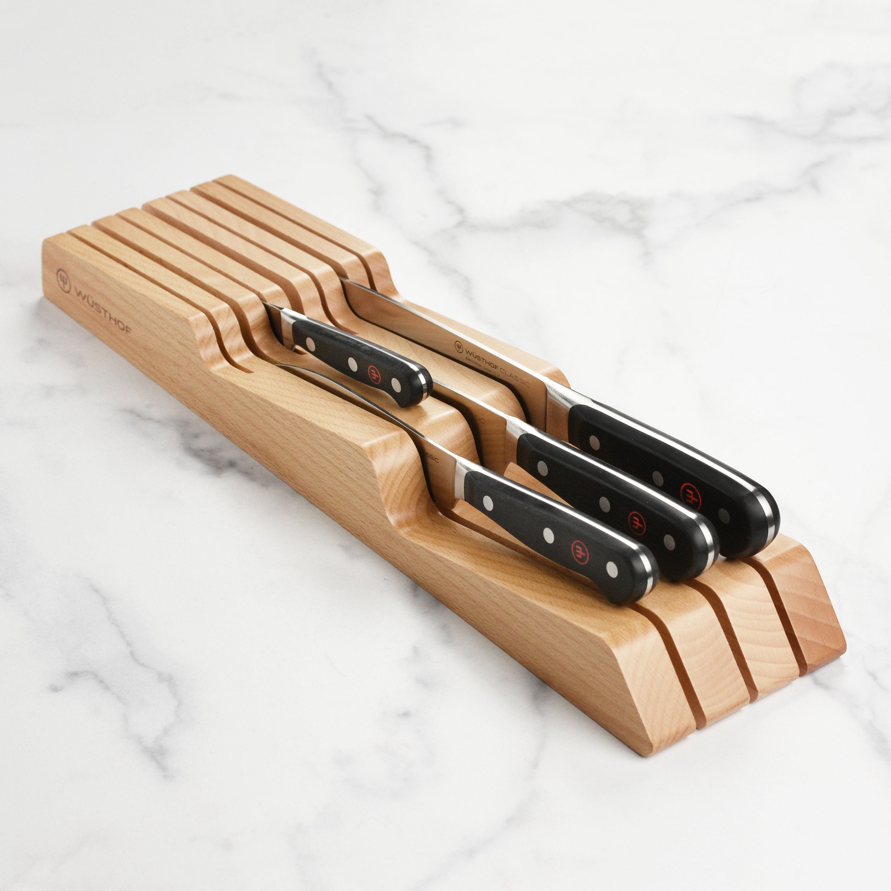 Wusthof Classic 5-Piece Chef Knife Set displayed in an elegant in-drawer knife block
