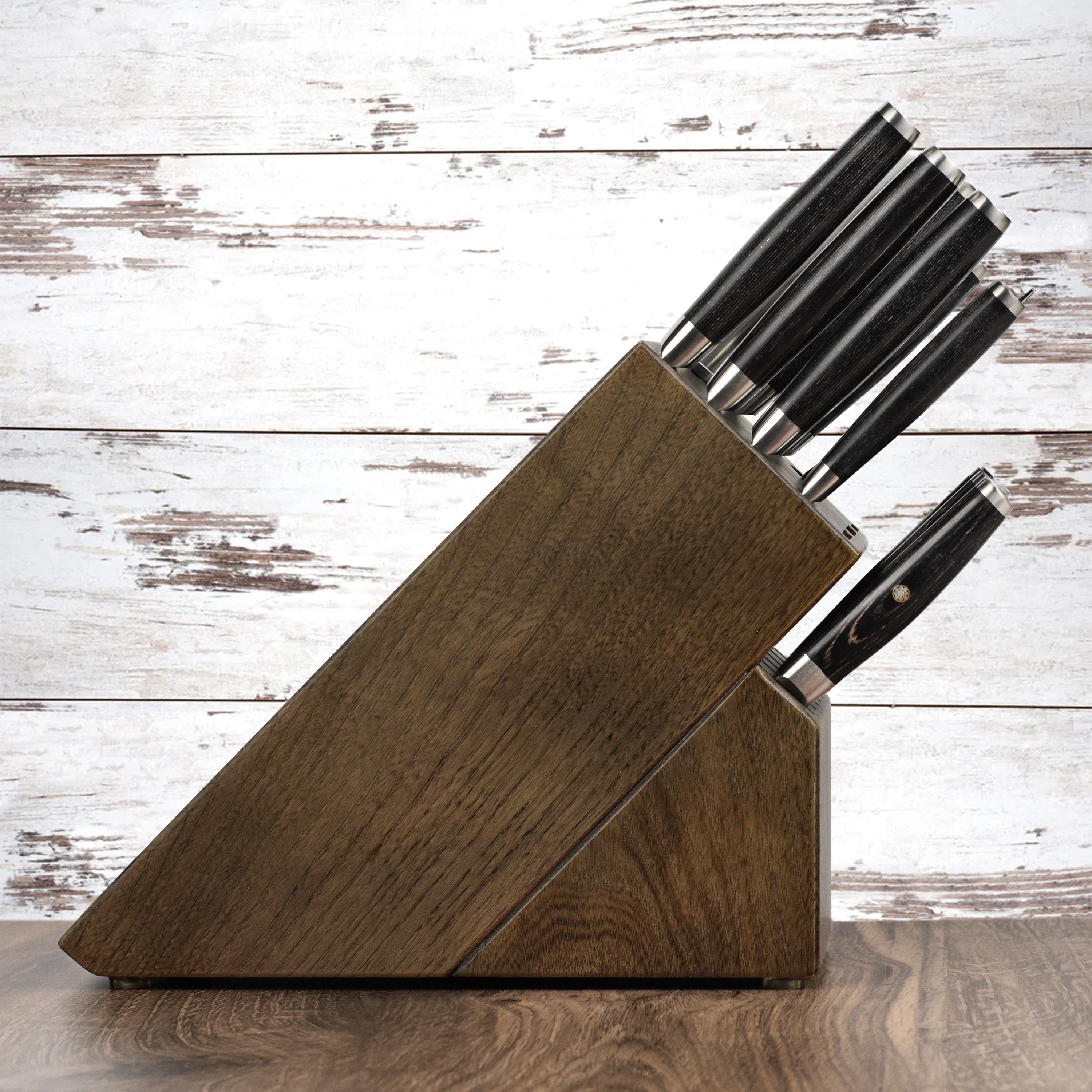 Close-up of the Yaxell Ketu knife blade showcasing the hammered finish and SG2 steel core.