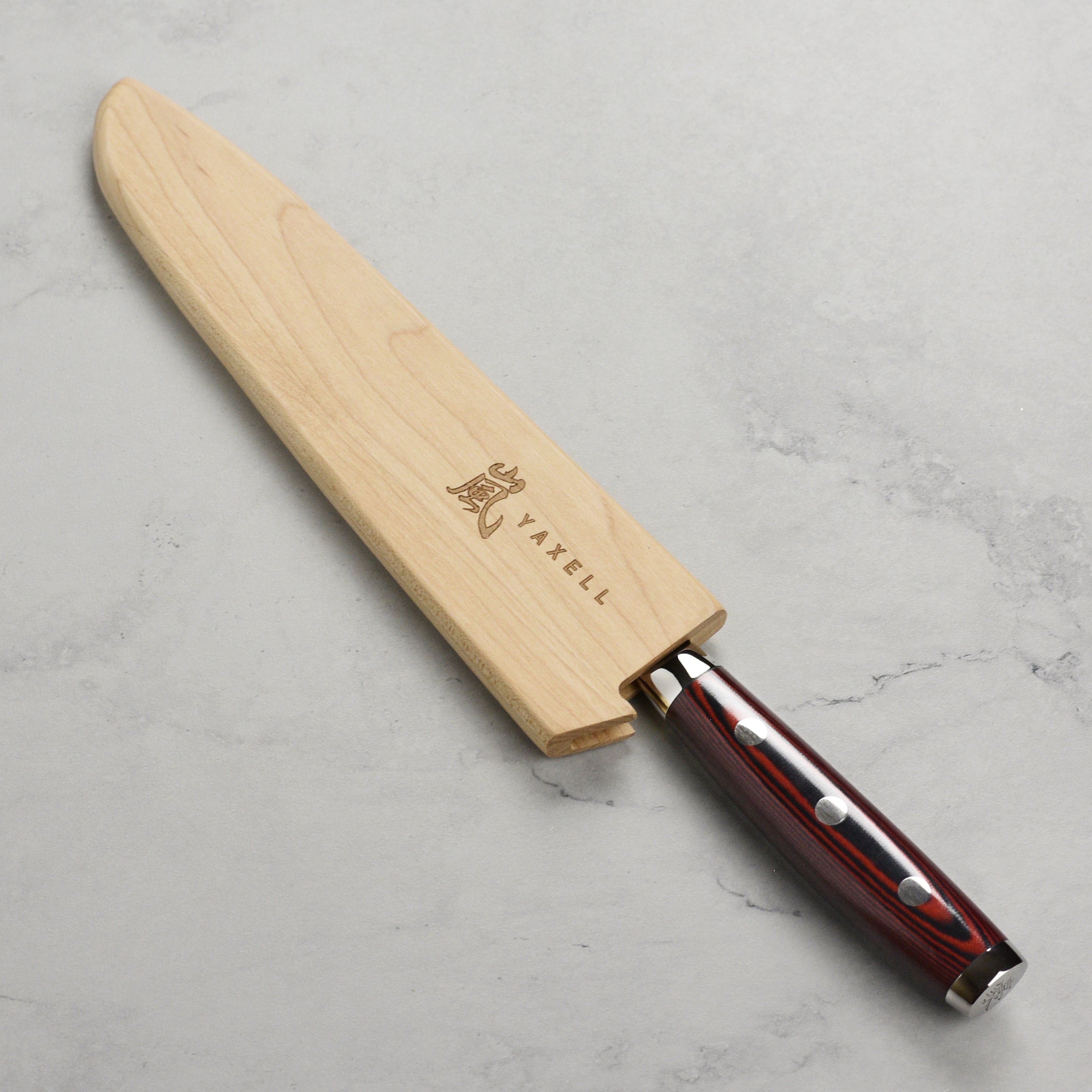 Yaxell knife sheath displayed with a 6-inch utility knife securely held in place.