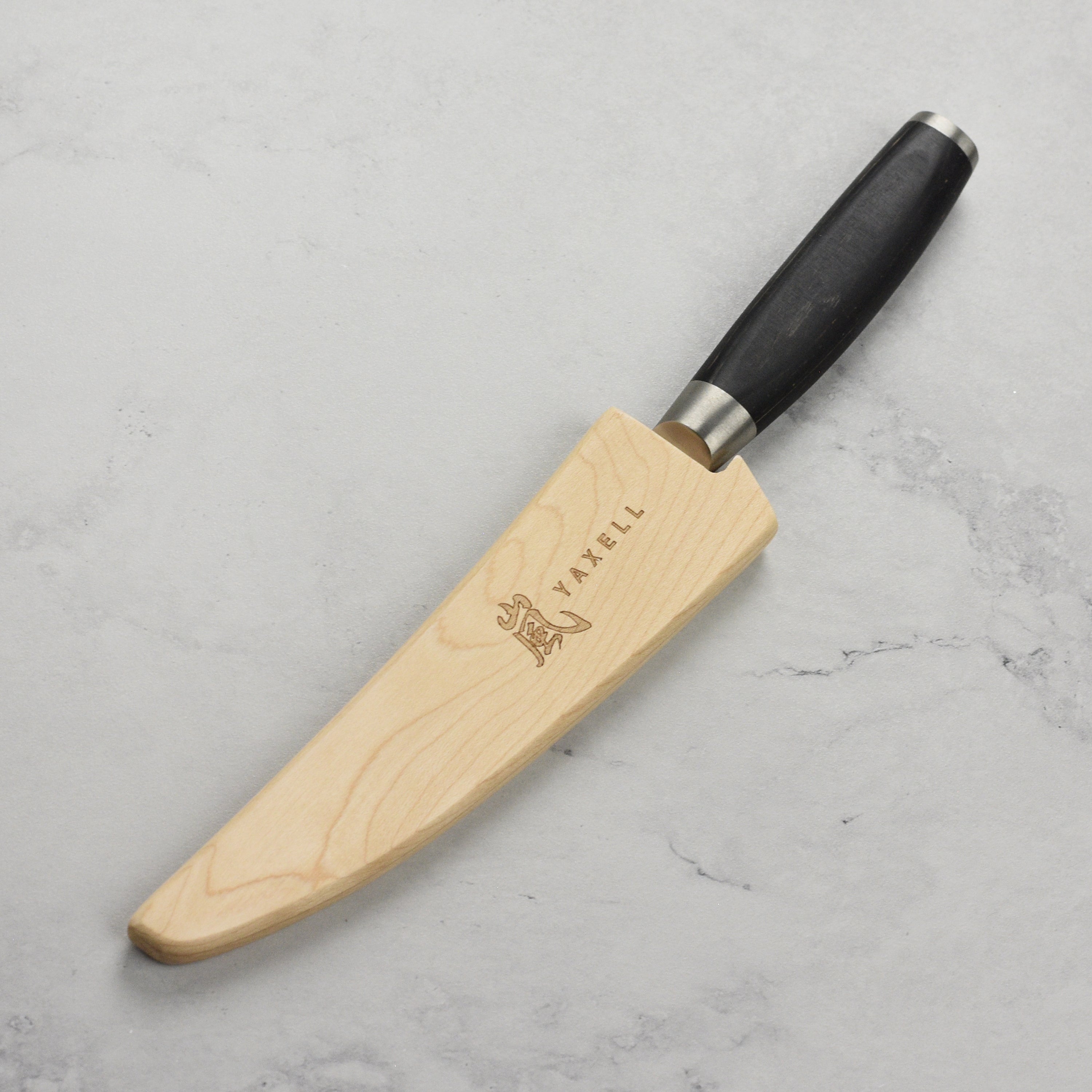 Close-up of the beechwood magnetic knife guard with embedded magnets.