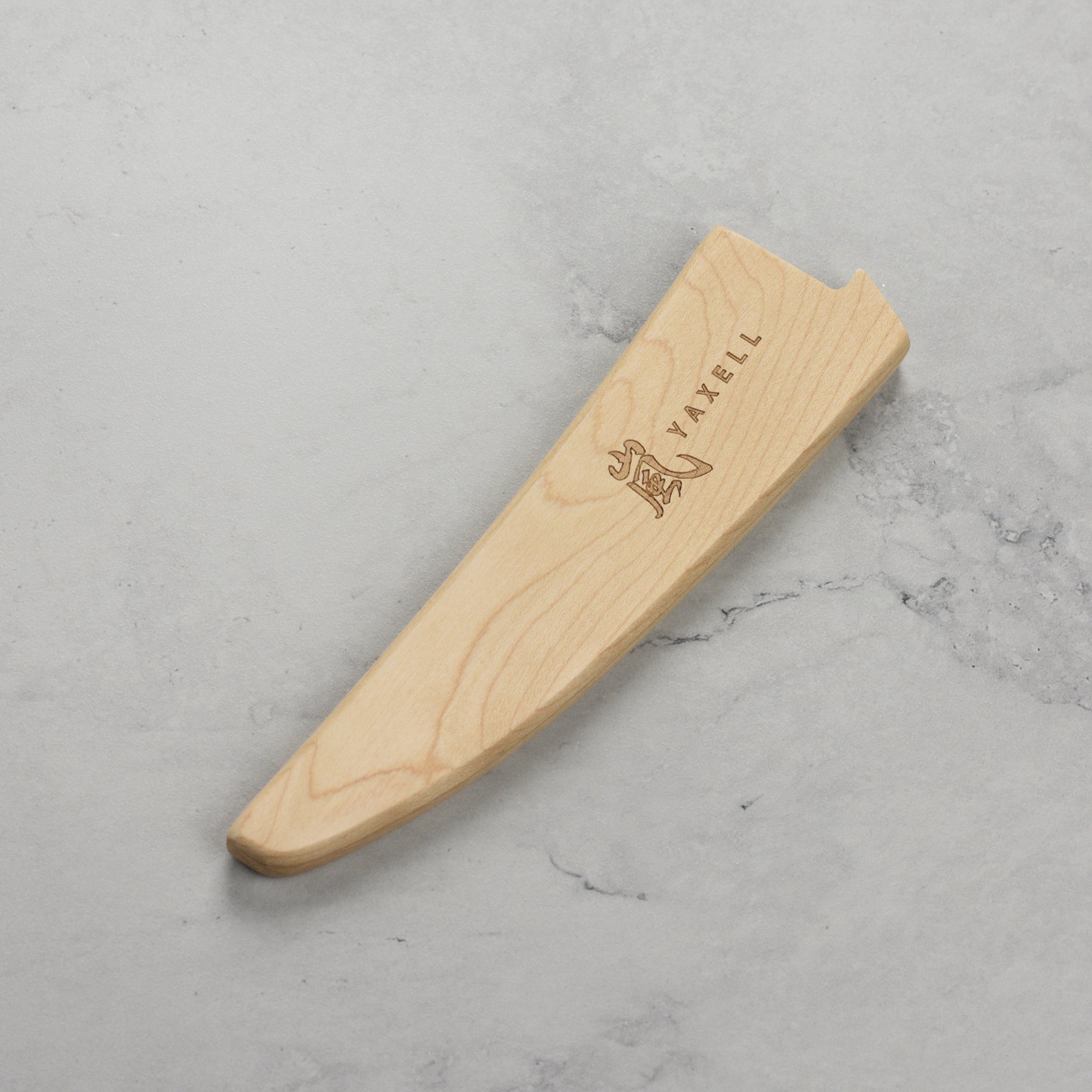 Yaxell magnetic knife sheath showcasing a 6 inch curved boning knife inside.