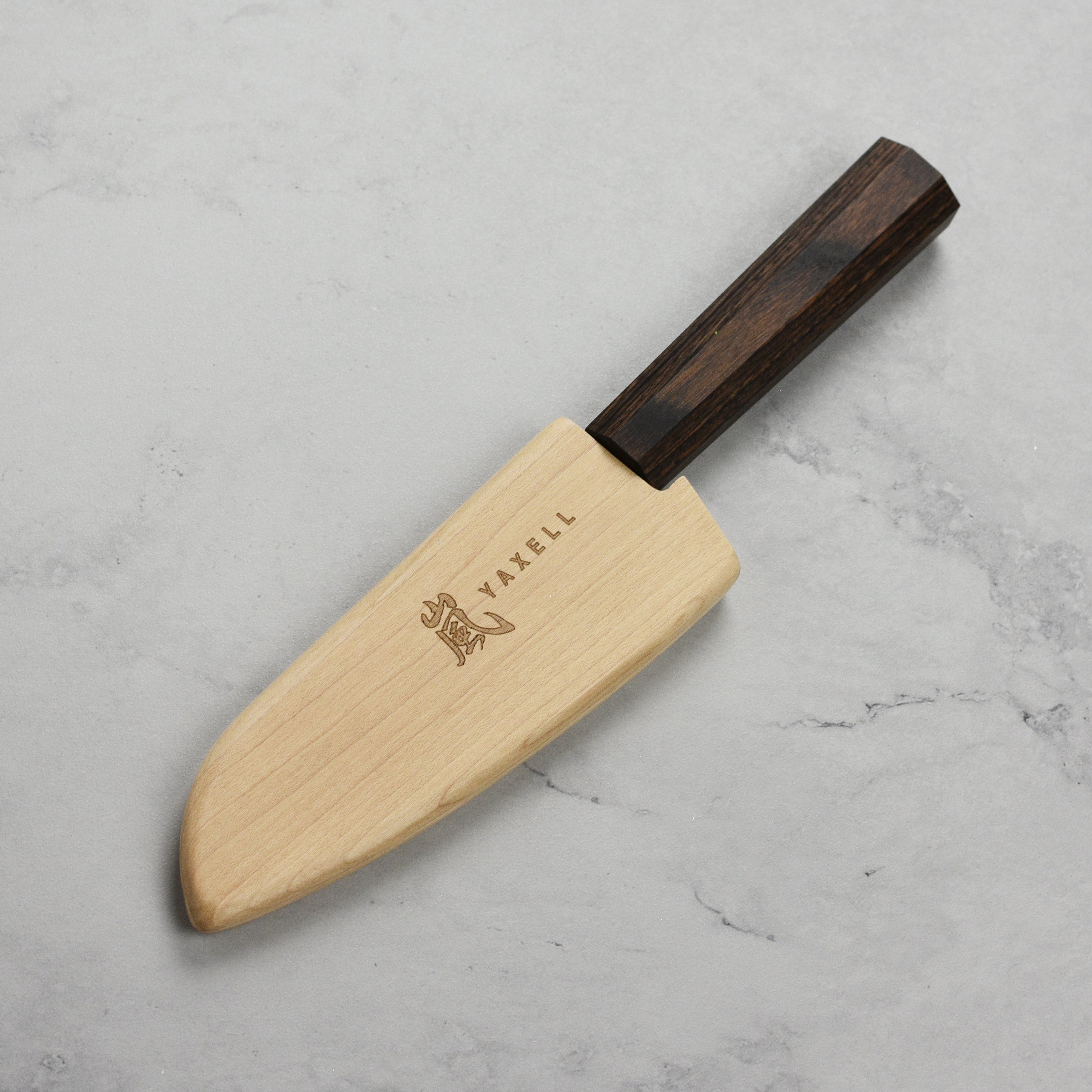 Side view of the wooden knife sheath holding a Santoku knife, highlighting its traditional design.