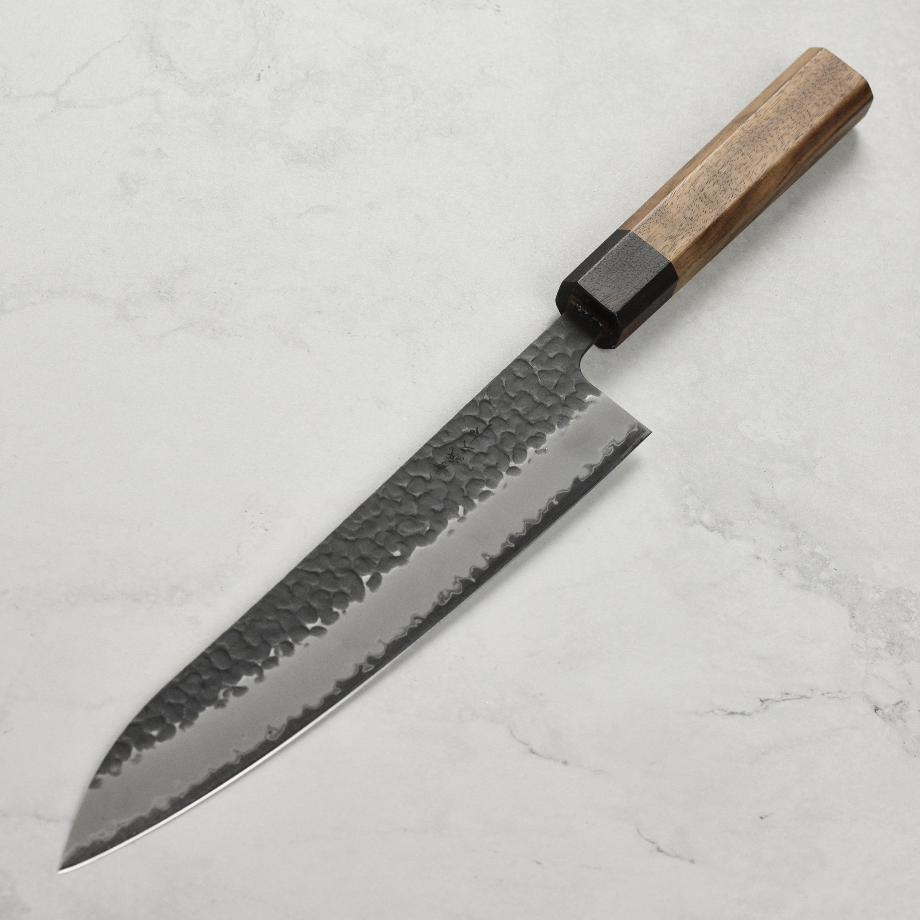 Close-up of the sharp edge on a gyuto knife used for slicing vegetables