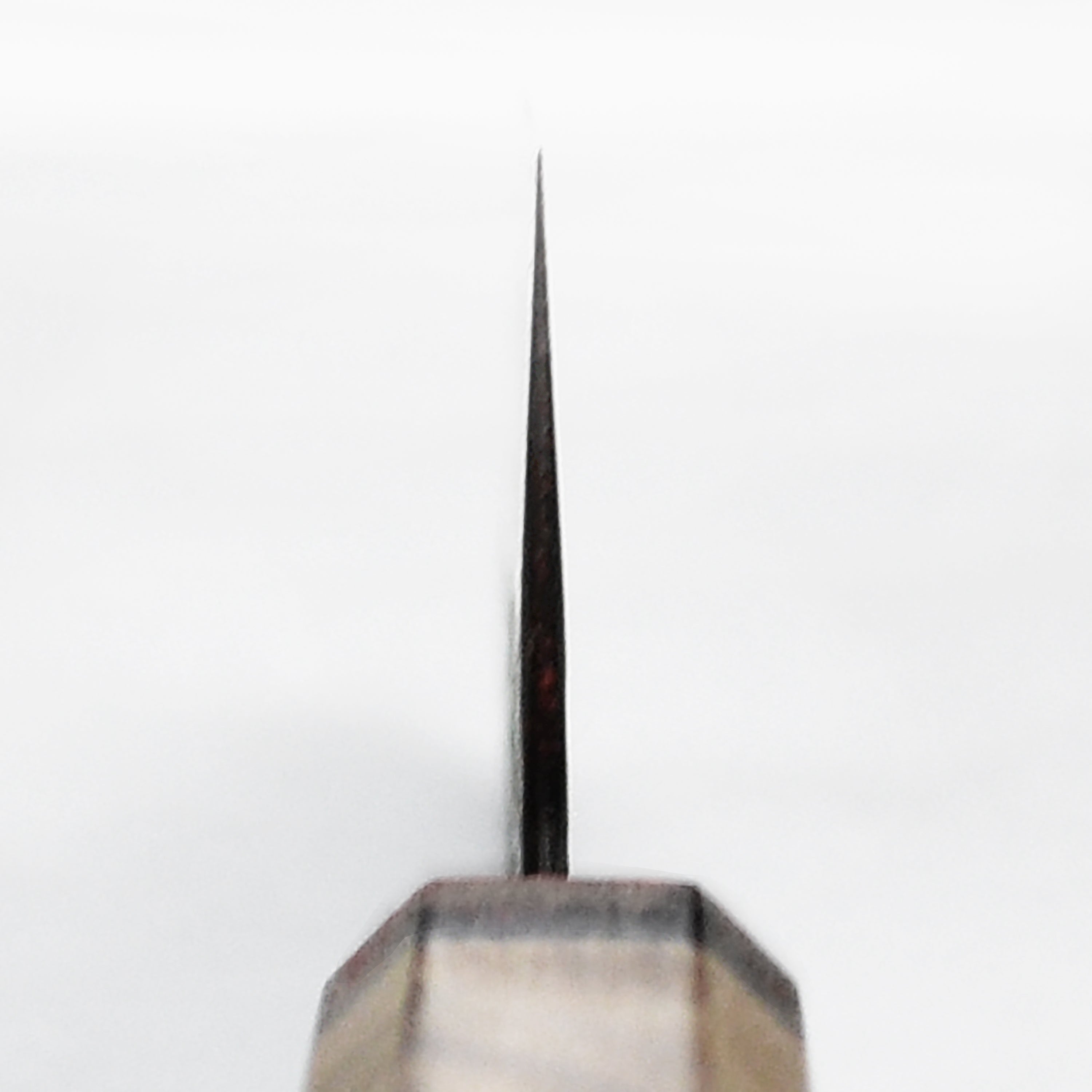 Close-up of the sharp edge on a gyuto knife used for slicing vegetables
