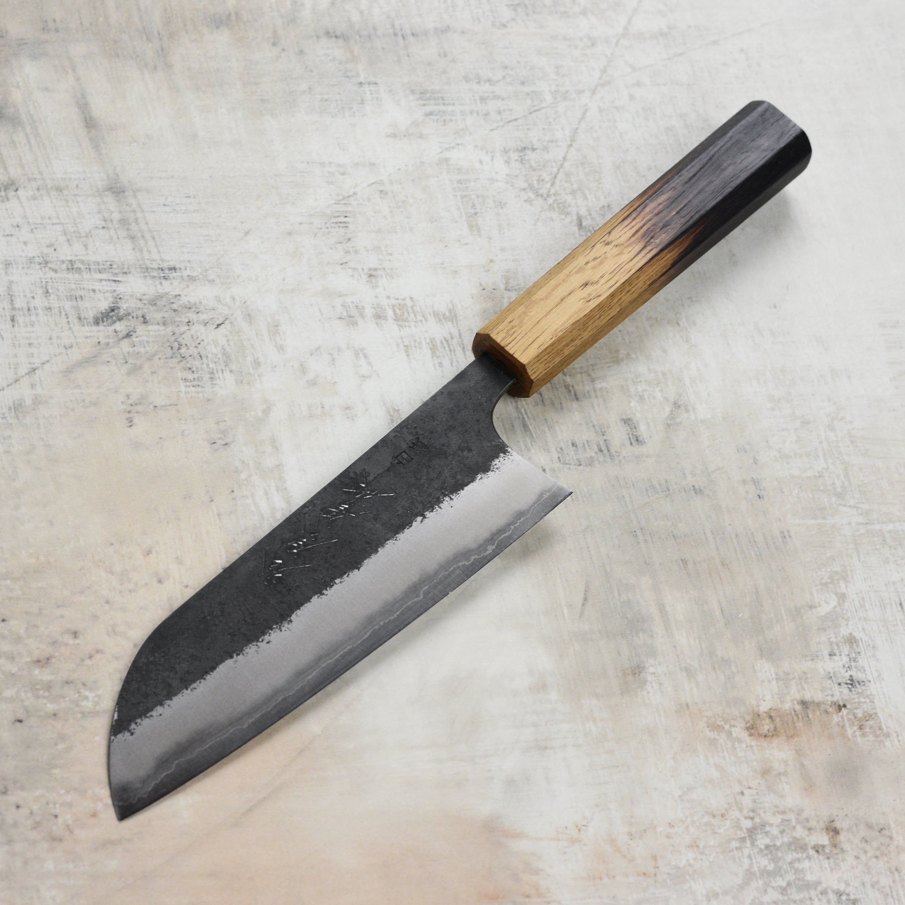 Japanese santoku knife with wooden handle and sharp blade for precise slicing