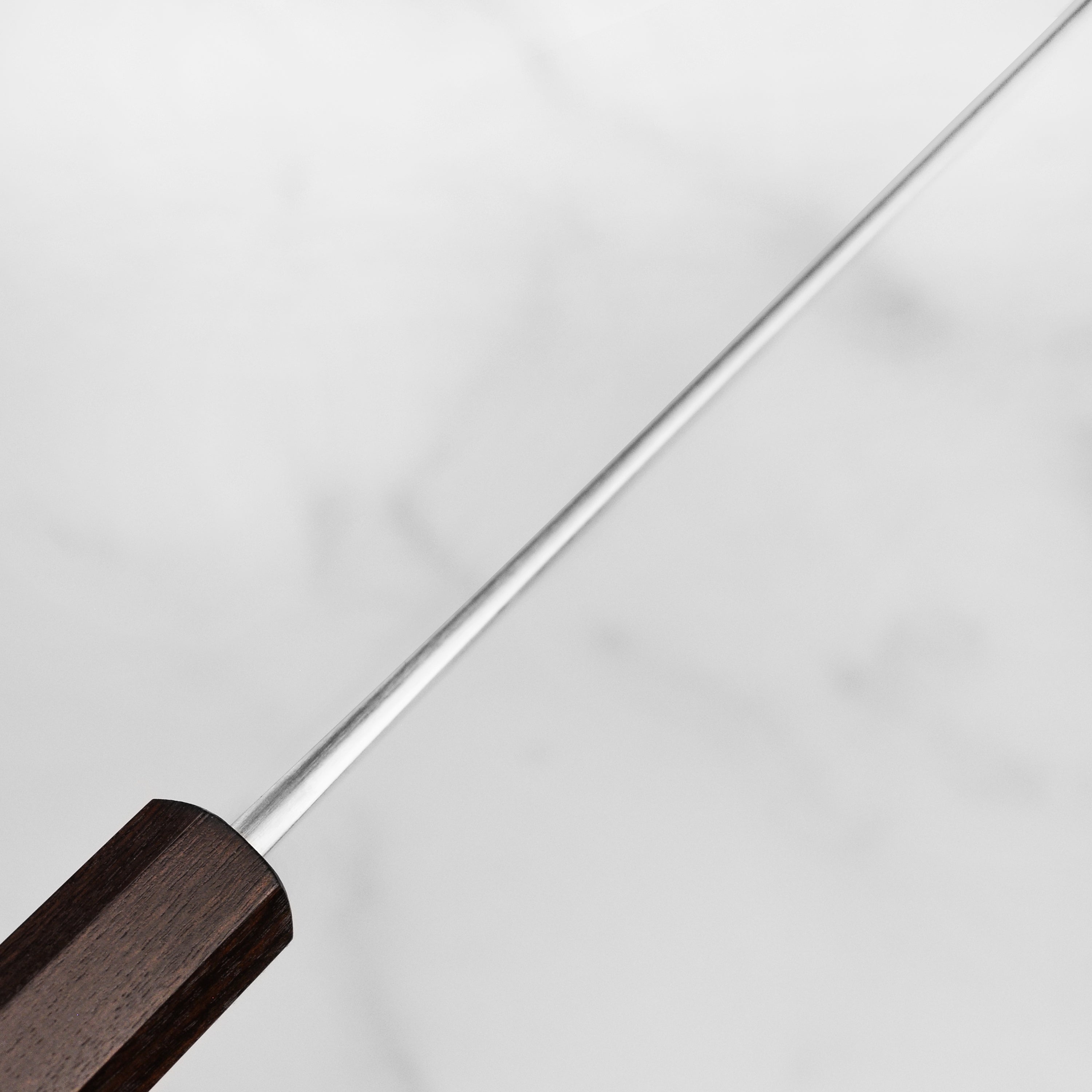 Japanese knife on a wooden cutting board demonstrating craftsmanship