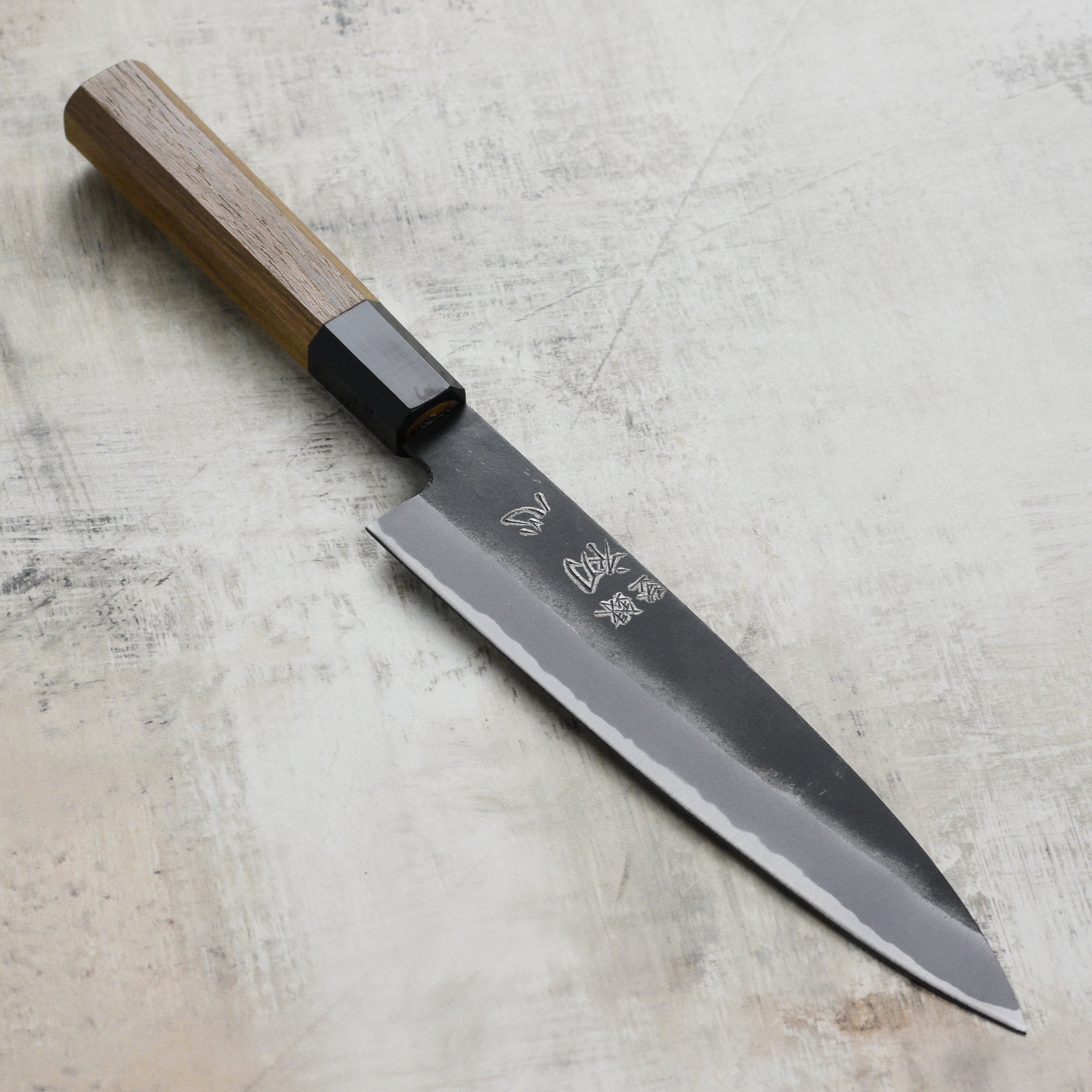 Hatsukokoro Aogami #2 Kurouchi Gyuto Knife from the side showcasing its elegant design