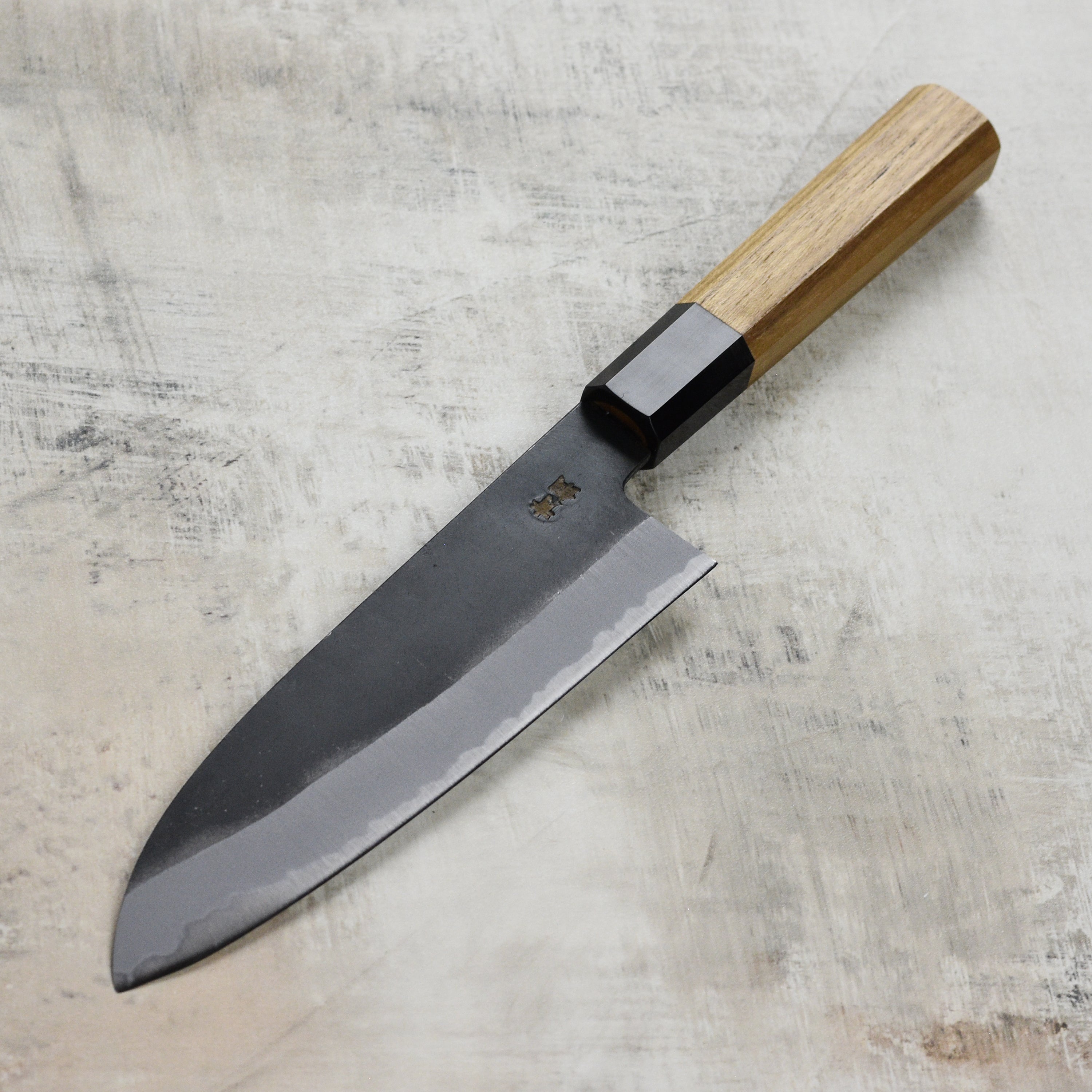 Versatile Santoku knife in a professional kitchen setting, perfect for slicing and dicing