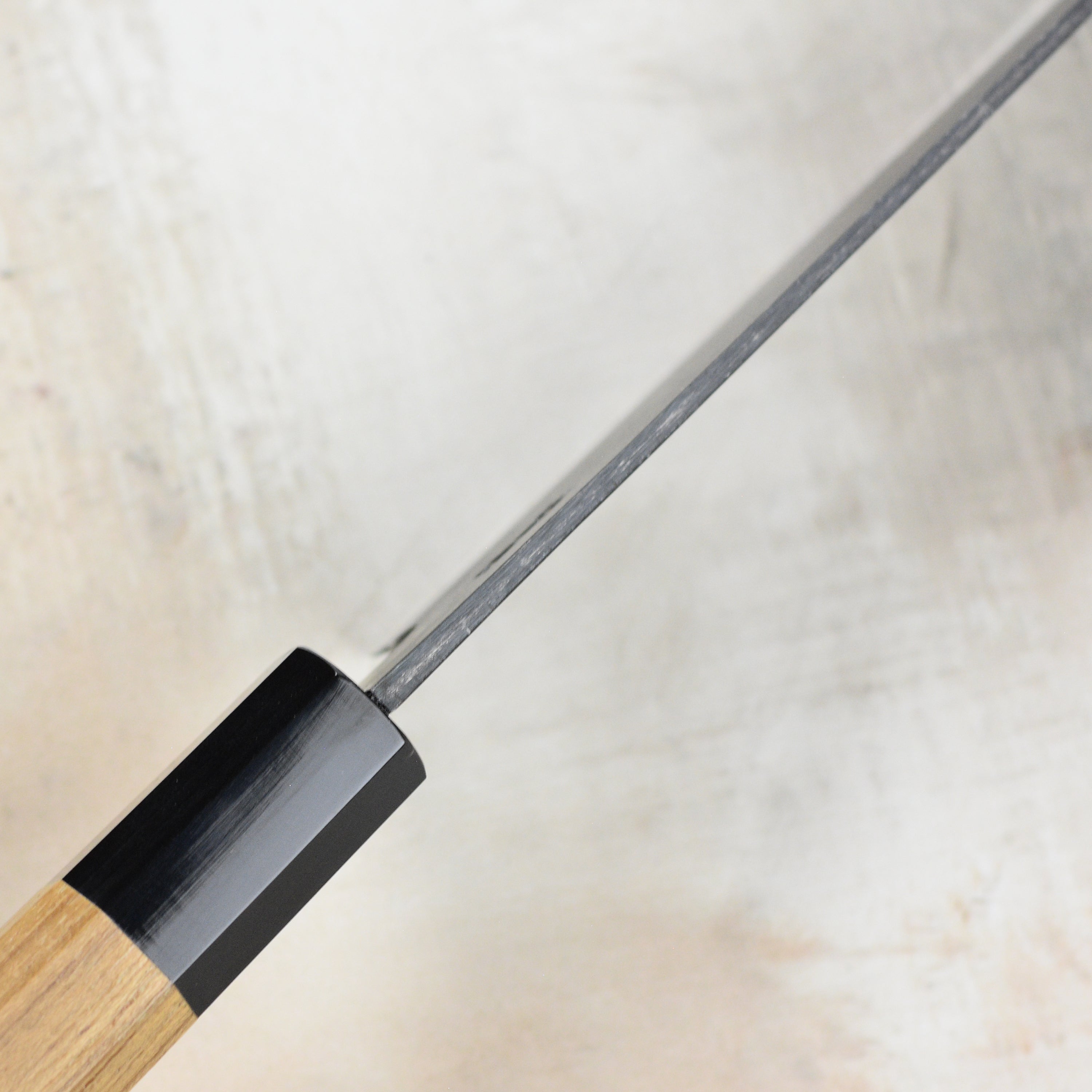 Versatile Santoku knife in a professional kitchen setting, perfect for slicing and dicing