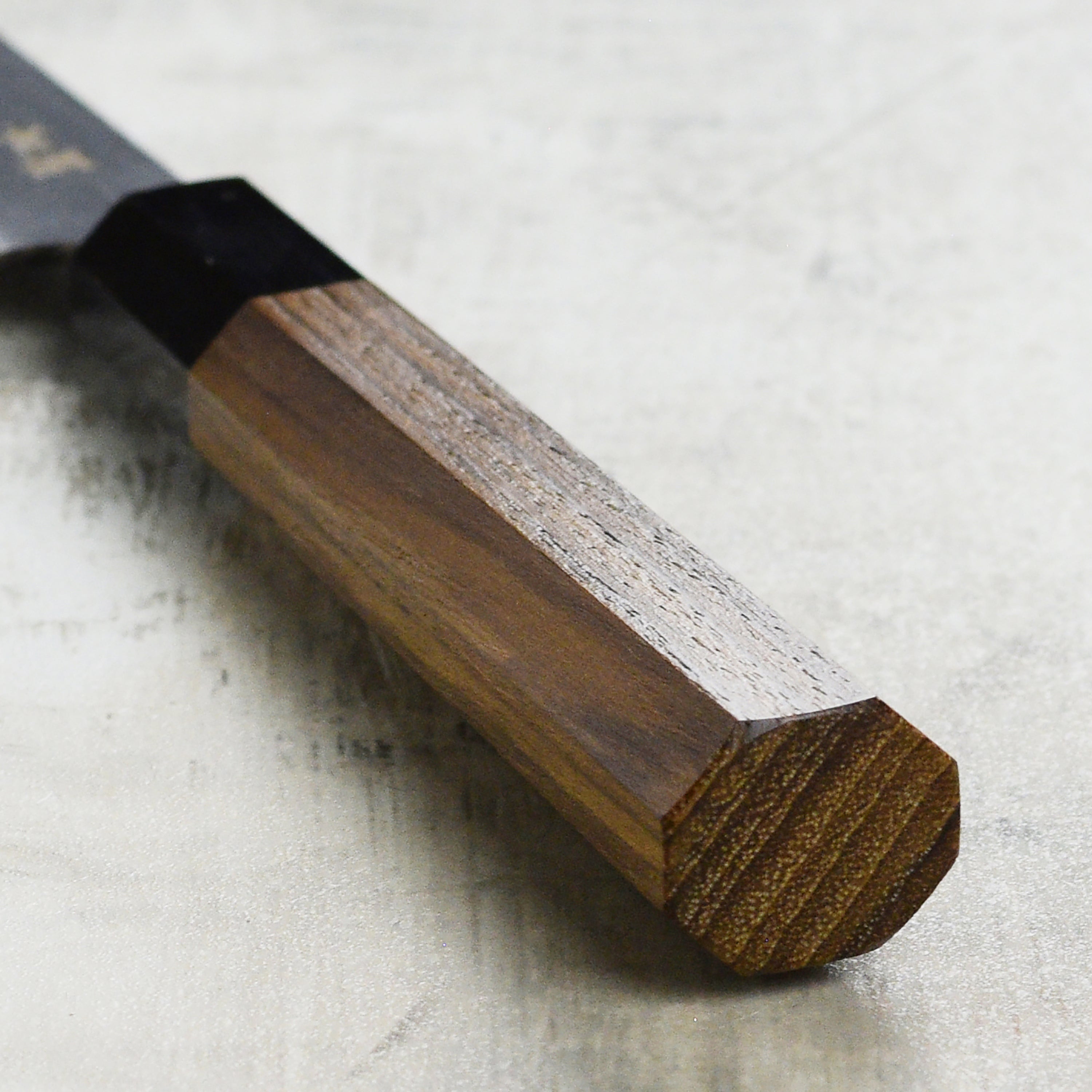 Using the petty knife for slicing vegetables in a modern kitchen