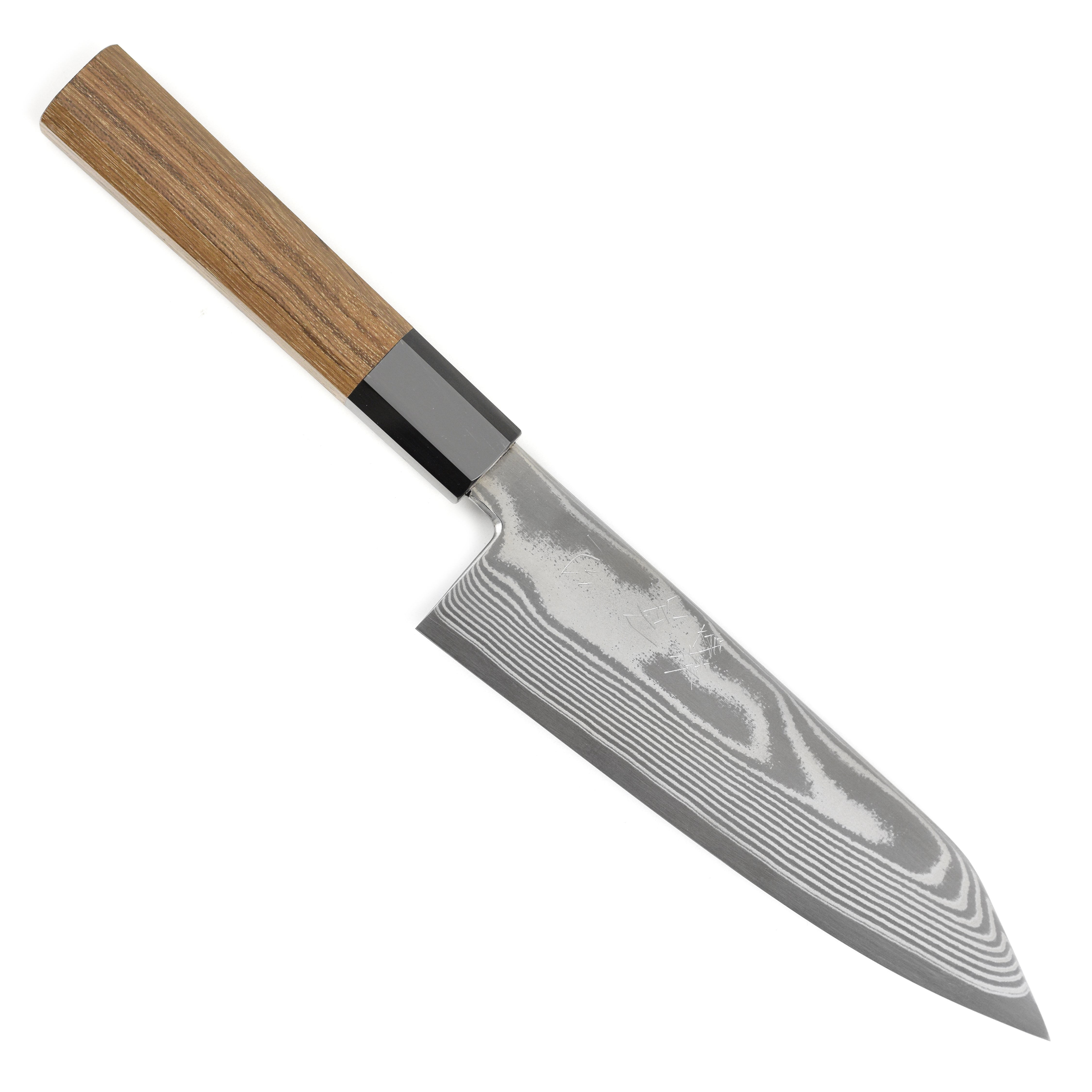 Professional chef using the Hatsukokoro Bunka knife for slicing vegetables