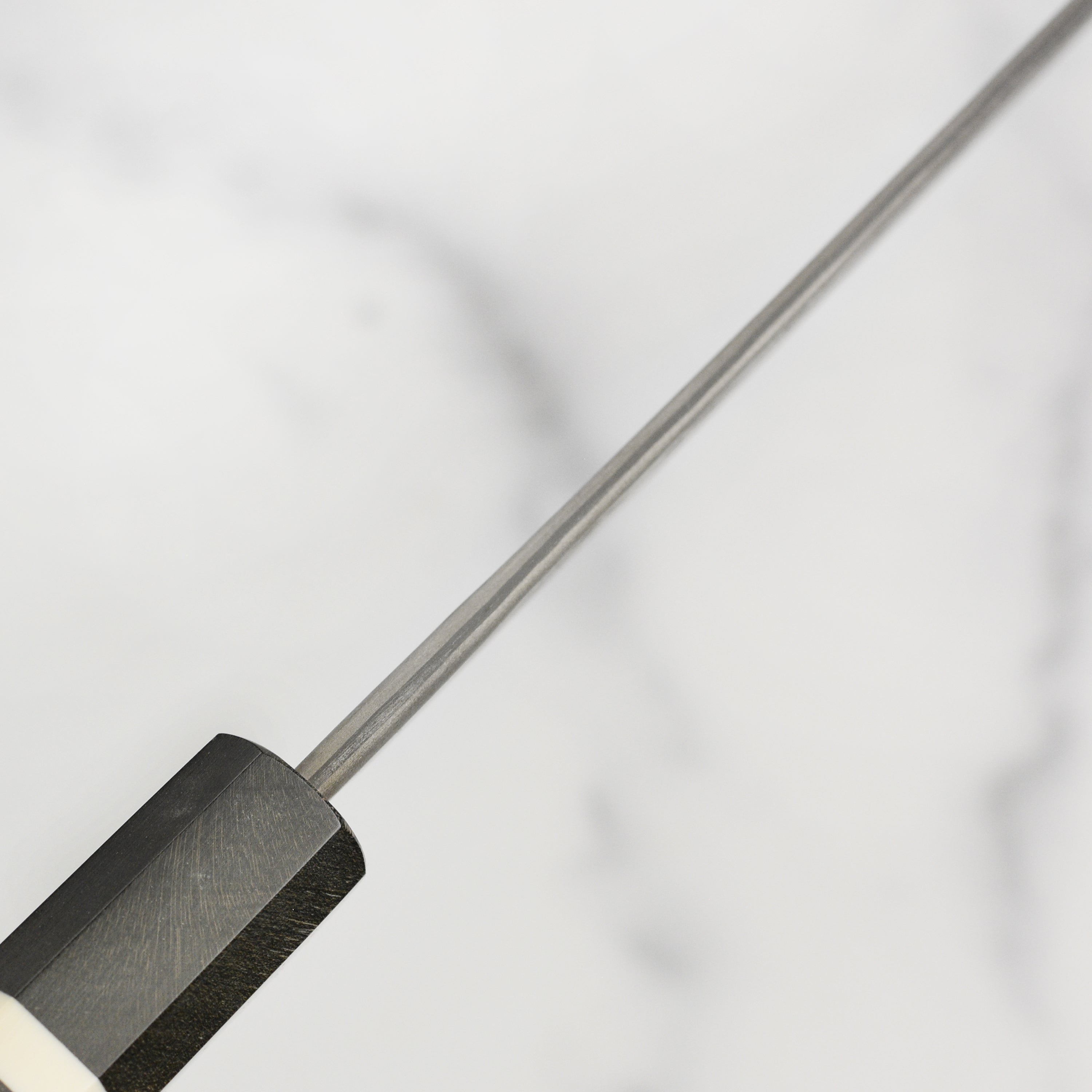 Close-up of the Premium Nigara Ginsan Damascus Sujihiki Knife showcasing its blade and handle.