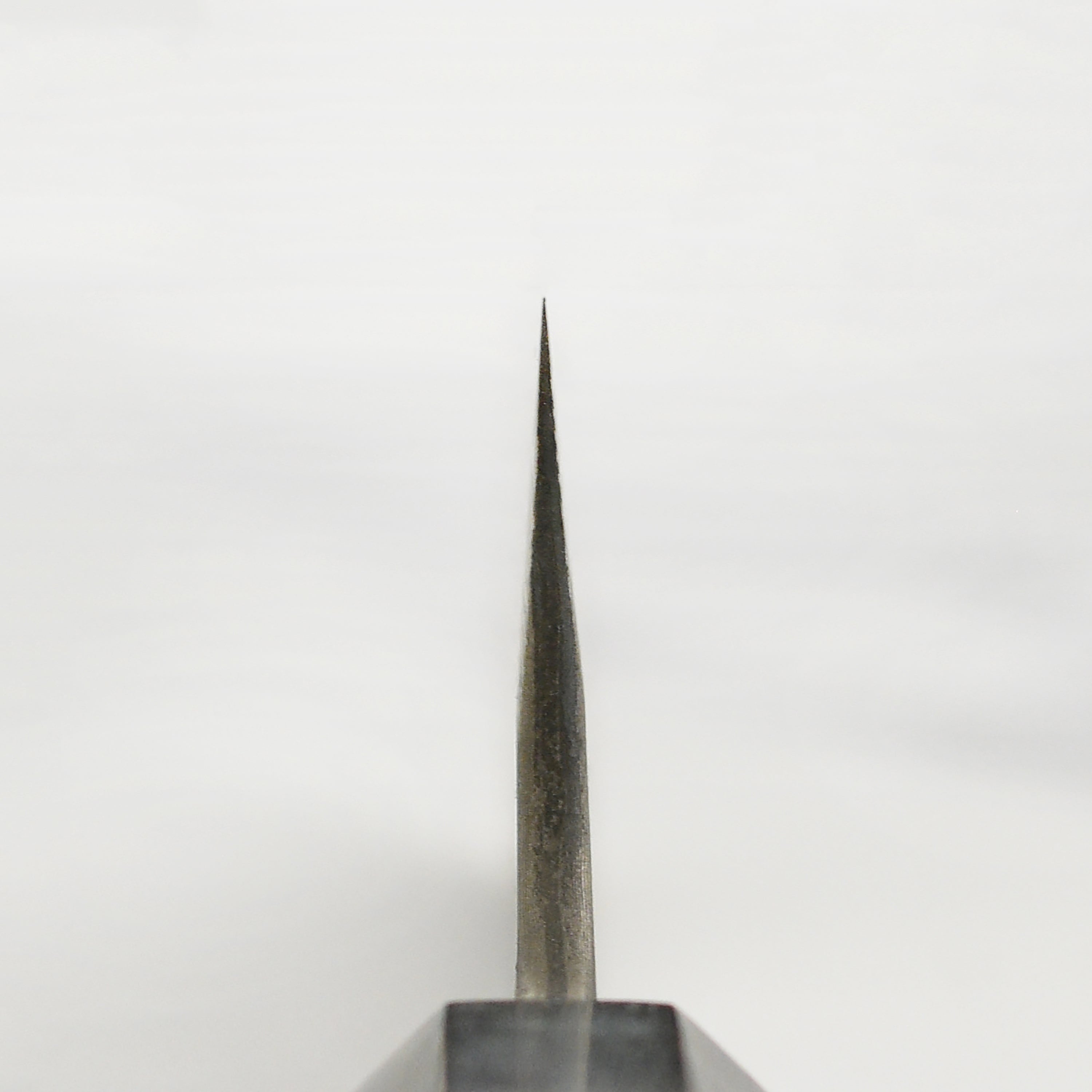Elegant display of the 11.8-inch Nigara Ginsan Damascus Sujihiki Knife on a wooden cutting board.