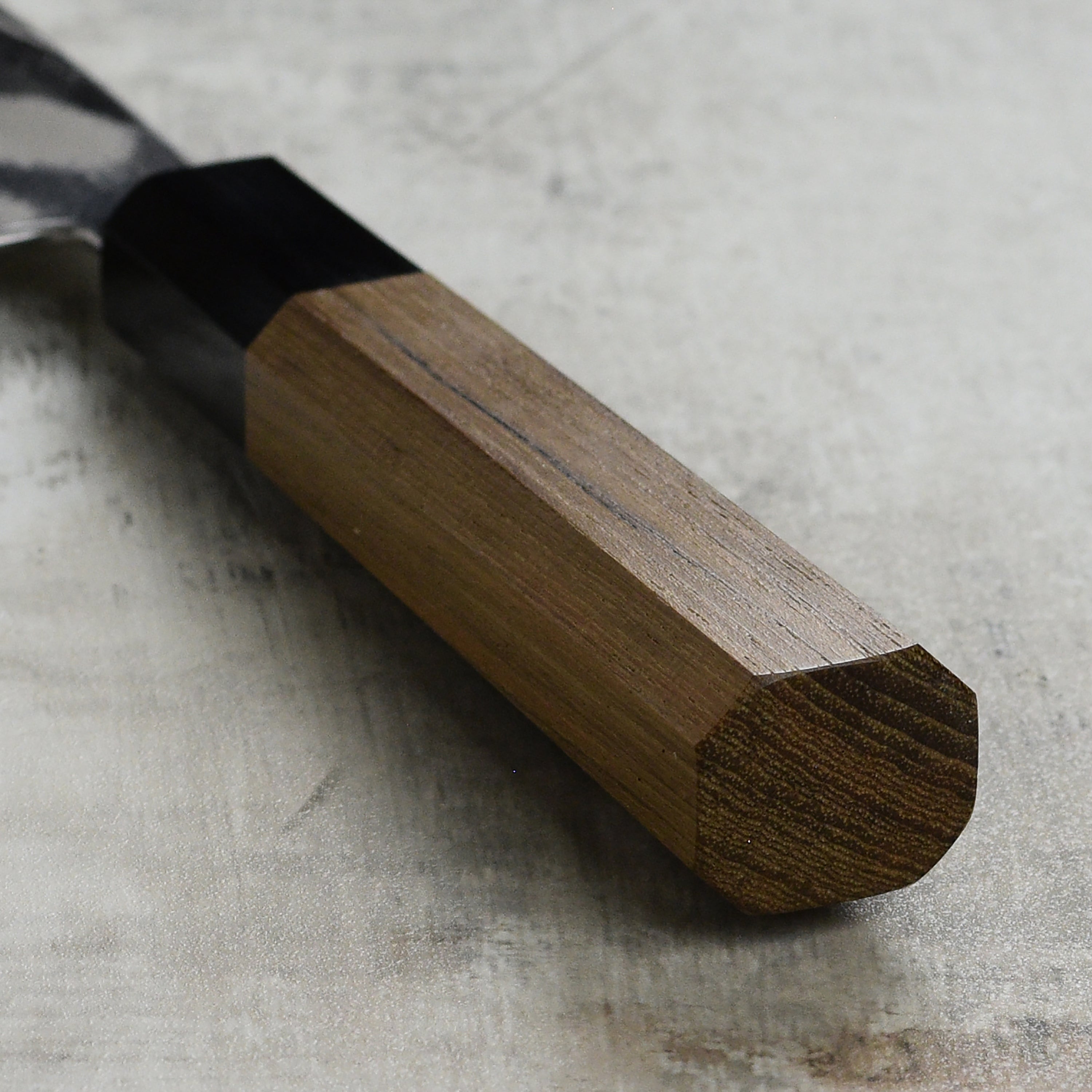 Chef slicing vegetables using the 7-inch santoku knife in a professional kitchen