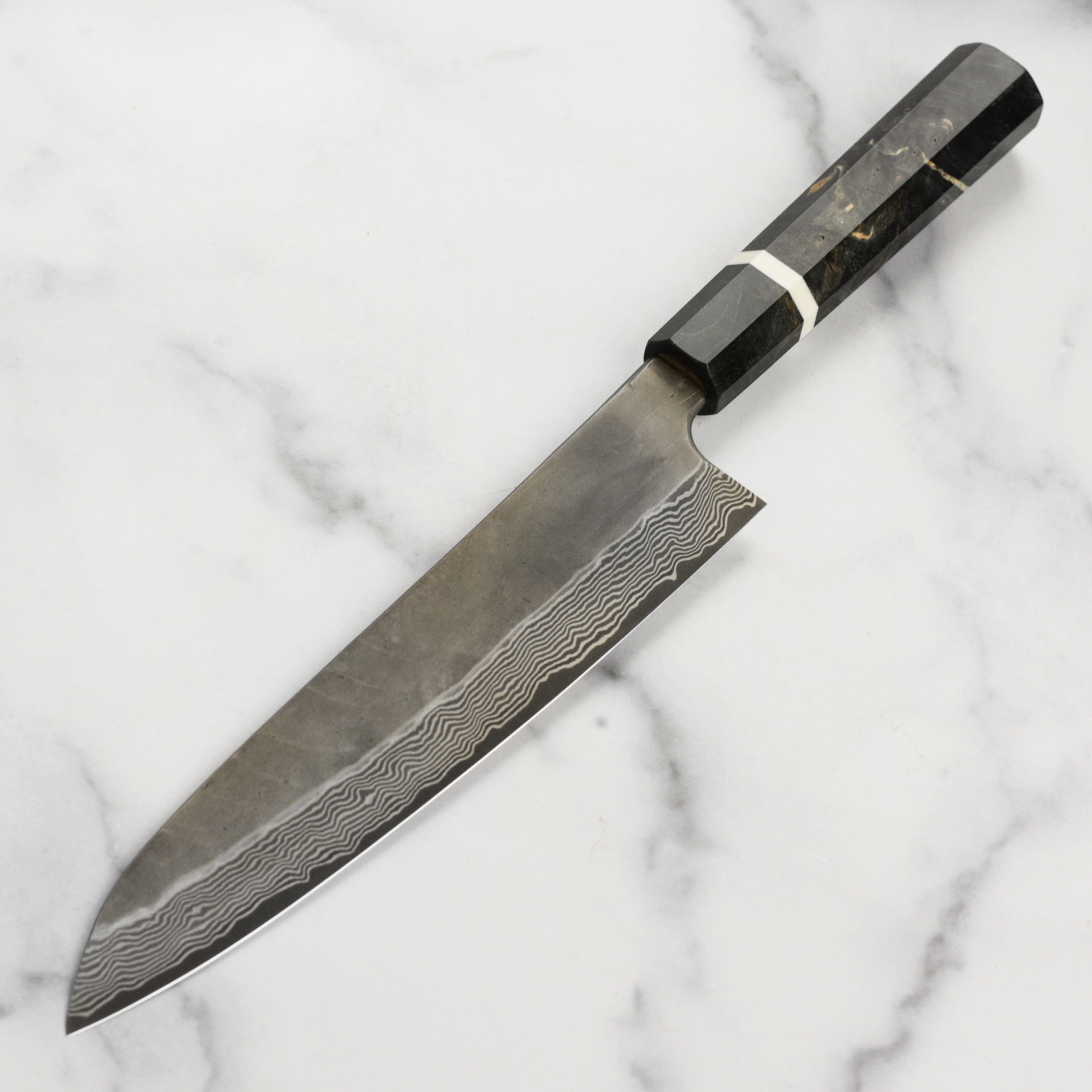 Nigara Ginsan Kurozome Damascus Gyuto knife with detailed steel pattern for professional chefs