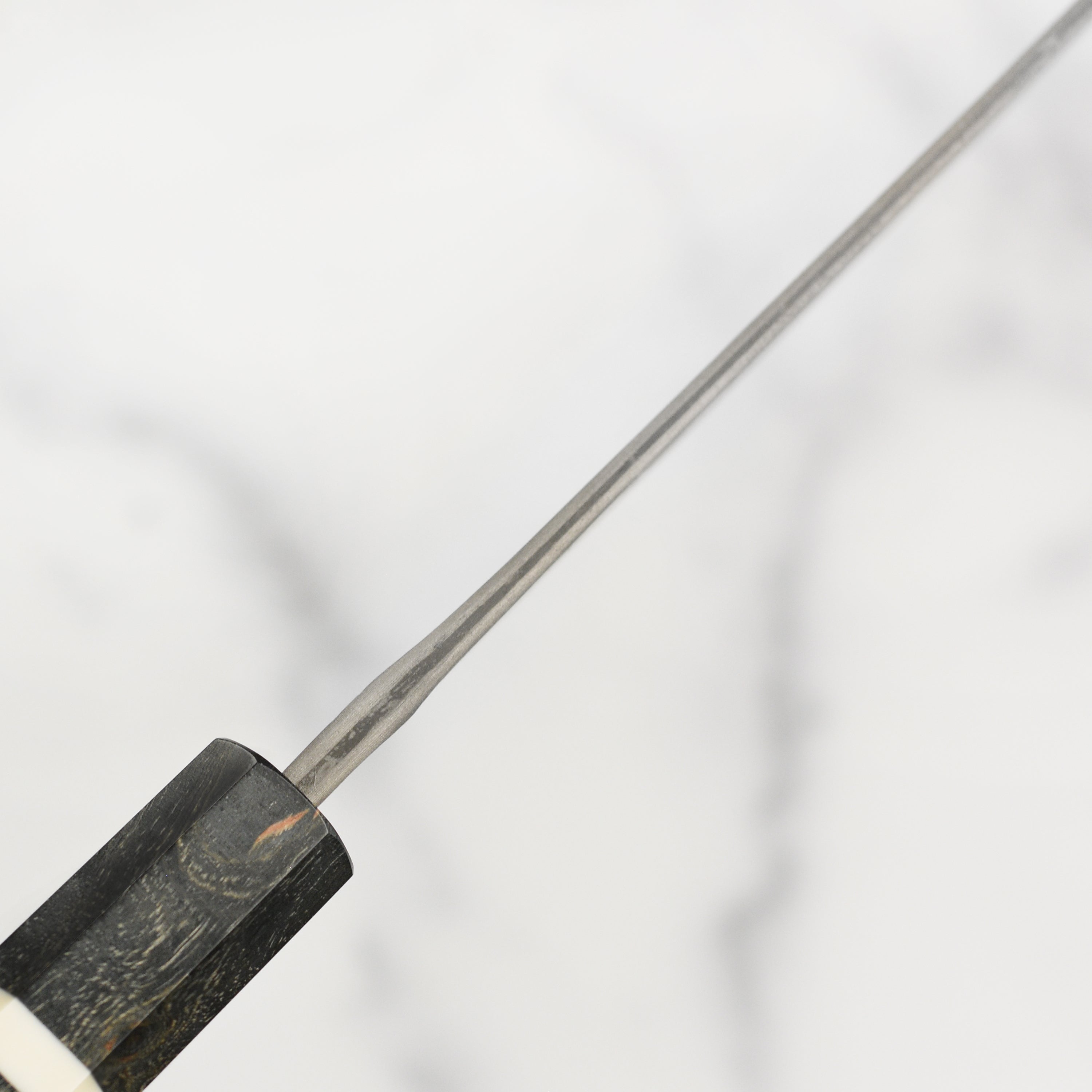 Full view of the Nigara Ginsan Kurozome damascus kiritsuke knife with ergonomic handle