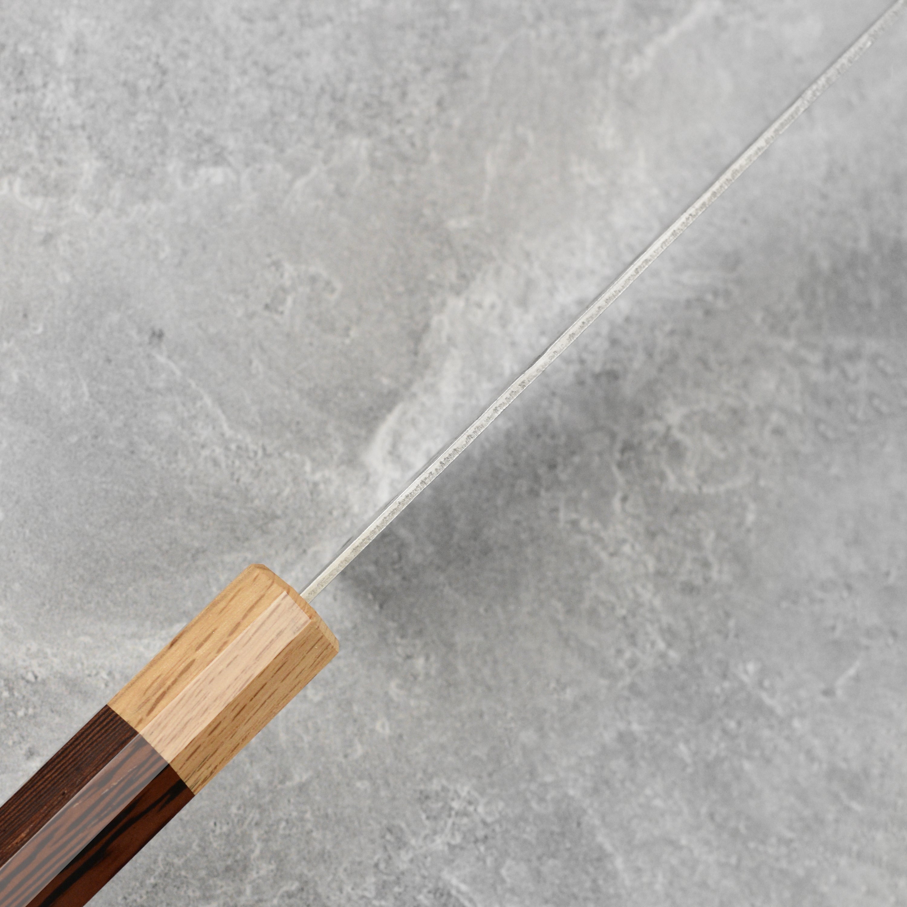 Top view of the Enso Ginsan 9.4 inch gyuto highlighting its handle and blade design