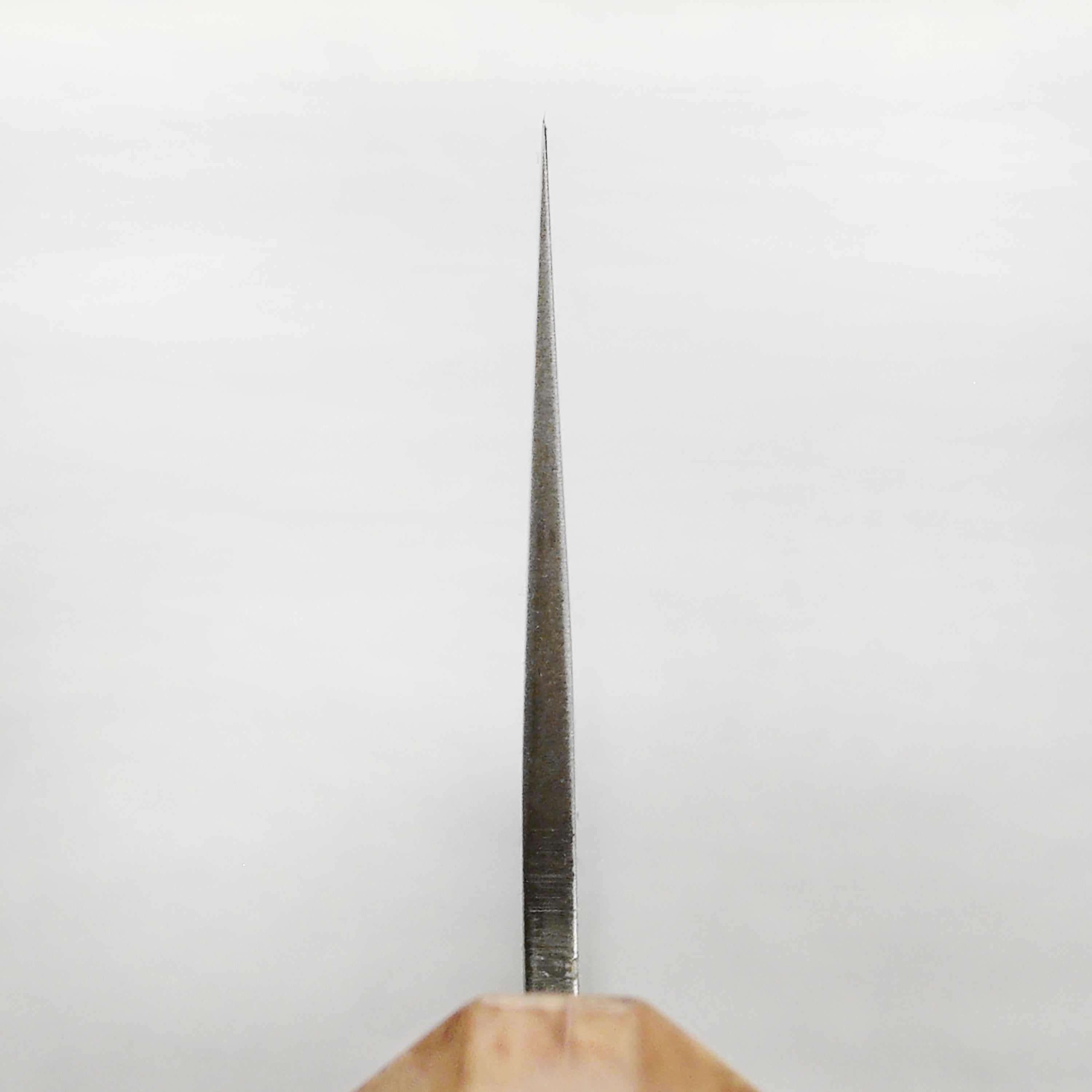 Enso Ginsan 6.5" Santoku knife showcasing its sharp blade and ergonomic handle in a kitchen setting.