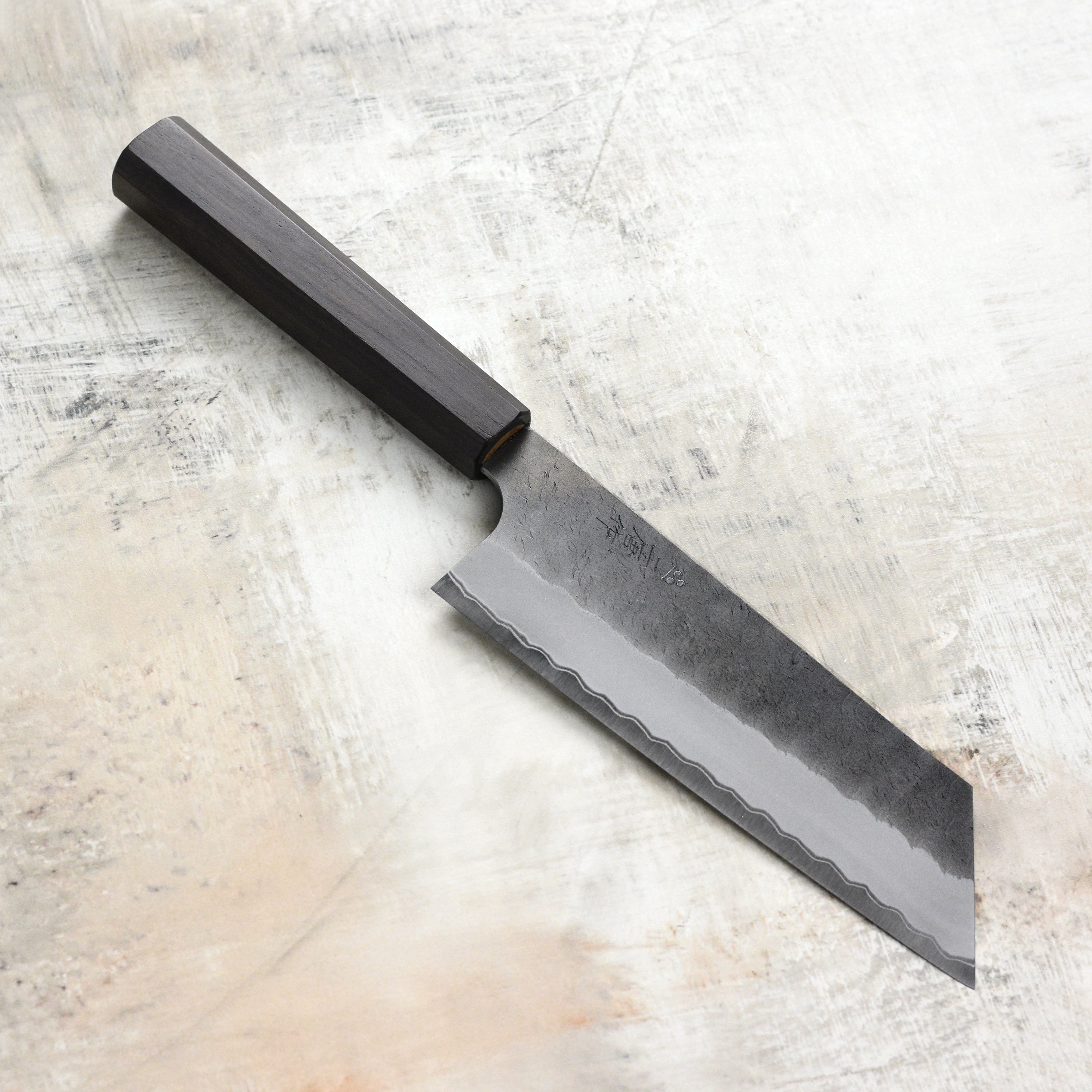 Premium Aogami Super Nakiri knife showcasing its sharp blade and tsuchime finish.