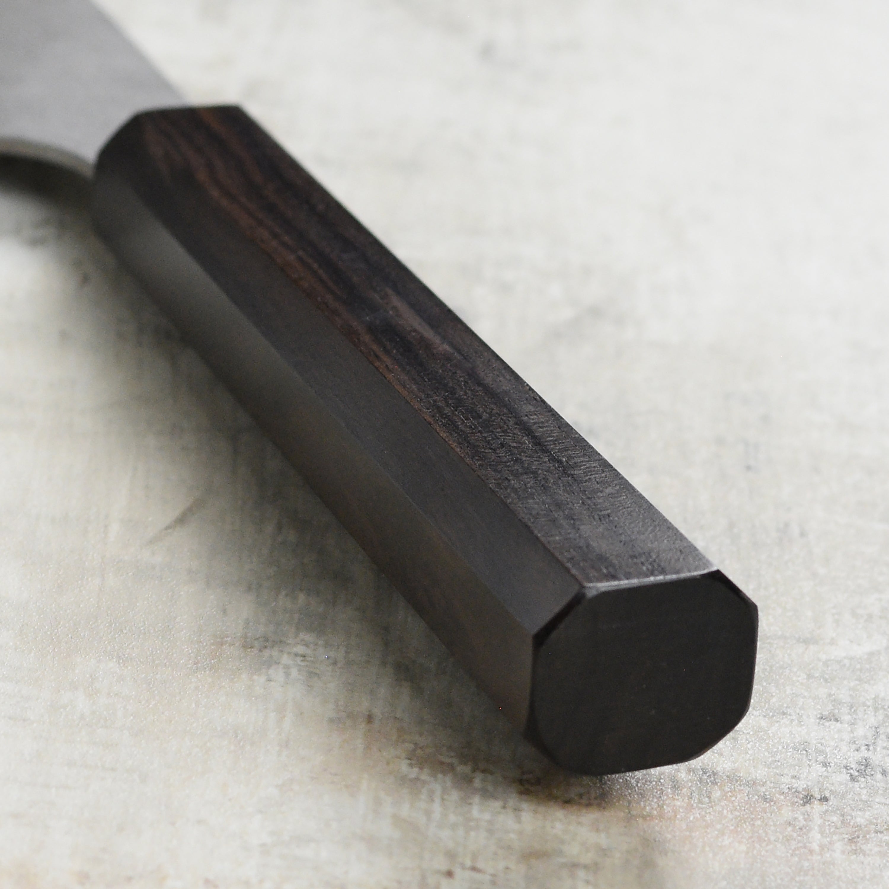 Close-up of the Aogami Super Migaki knife, highlighting its craftsmanship and design.