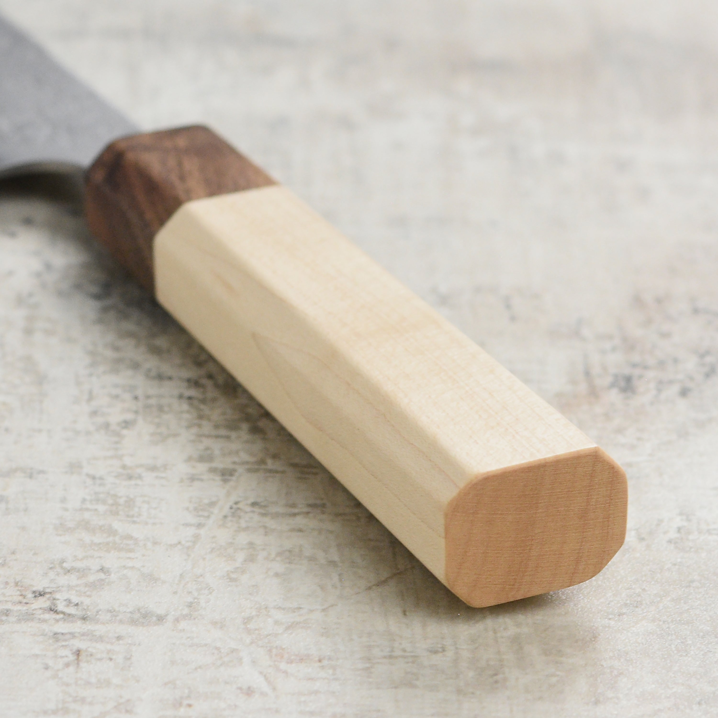 Using the Japanese kitchen knife for slicing vegetables in a modern kitchen