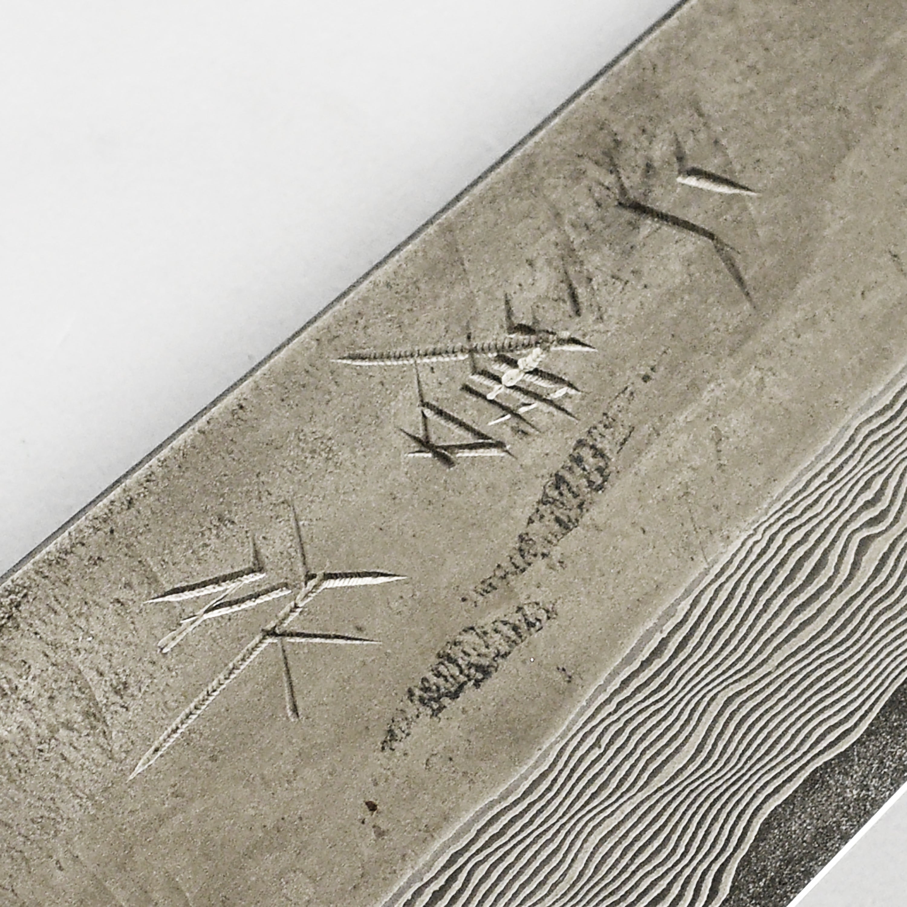 Elegant black handle of the damascus petty knife for comfortable grip