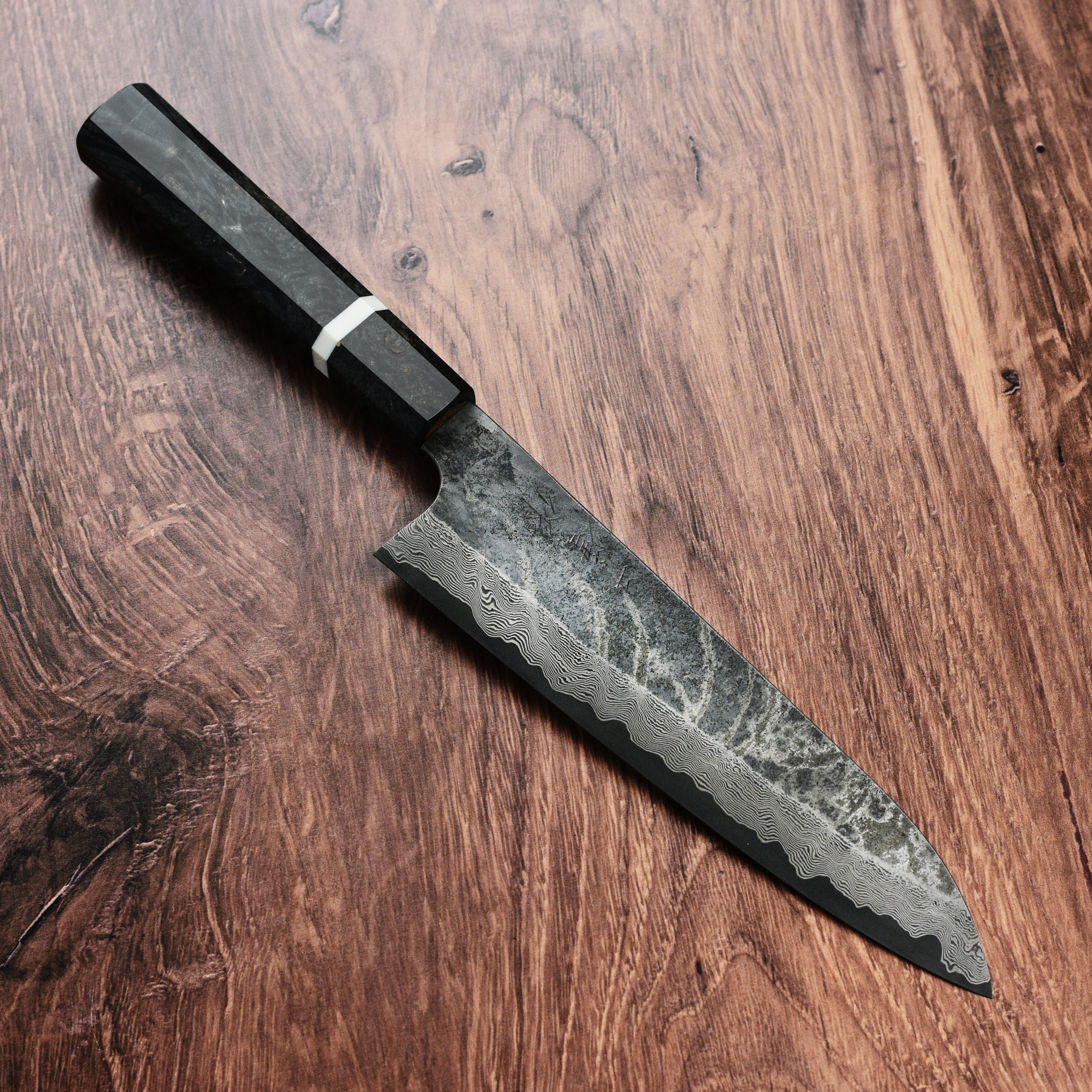 Chef slicing vegetables with Nigara Ginsan Kurozome Damascus gyuto knife