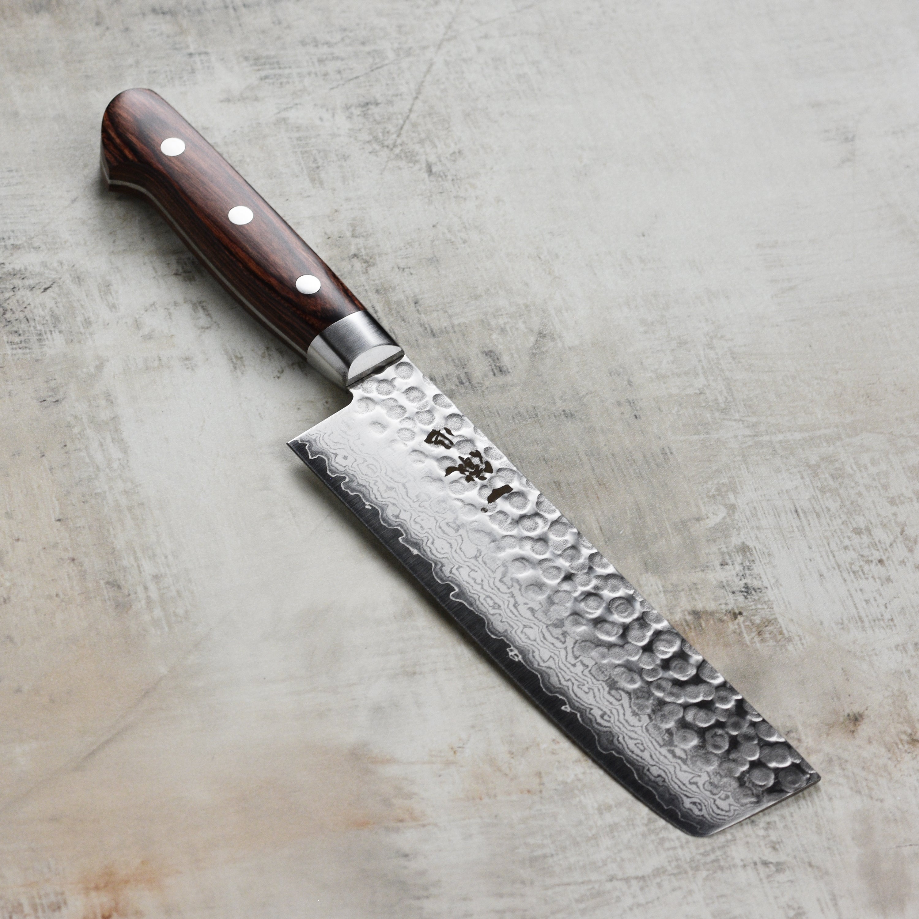 Ittetsu VG10 Hammered Damascus Nakiri Knife showcasing its blade and handle design.