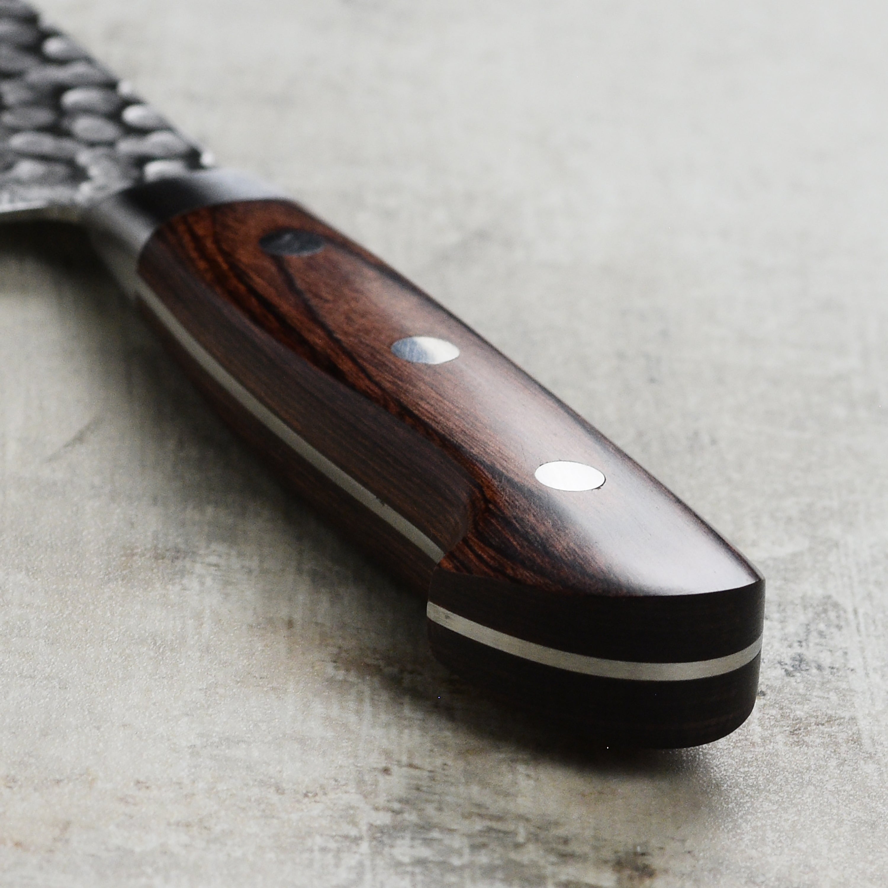 Close-up of the edge of the nakiri knife demonstrating its cutting precision.