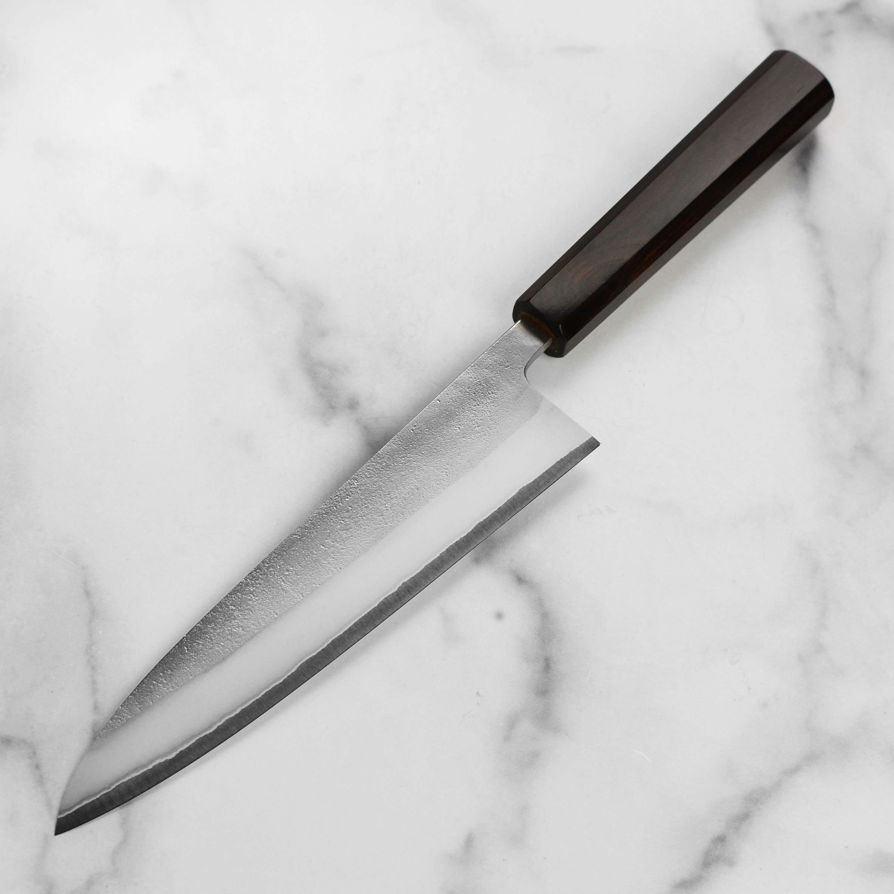 Close-up of the sharp edge and Nashiji finish of the Japanese chef knife