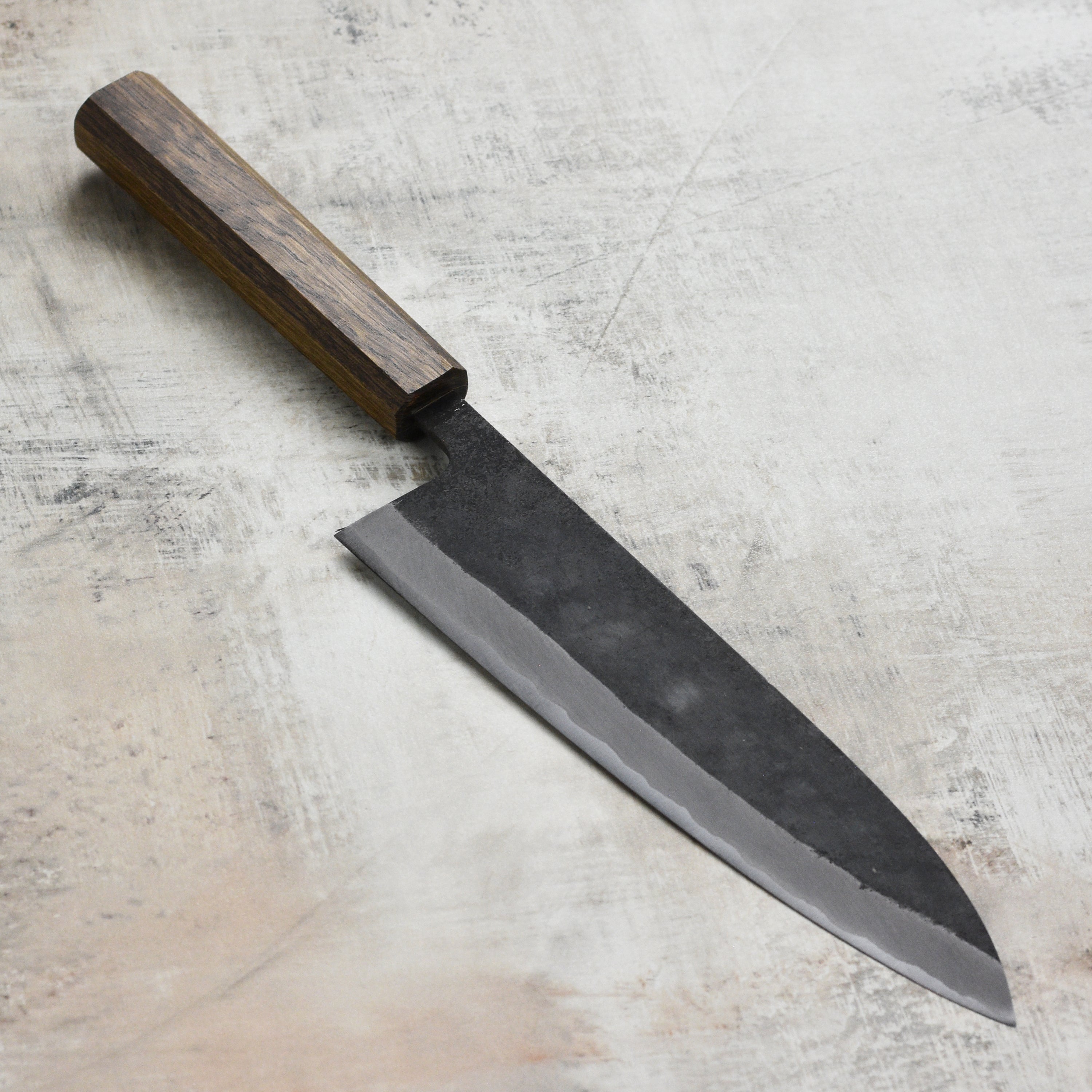 Full view of the 8.25-inch gyuto knife showcasing its ergonomic handle and blade design