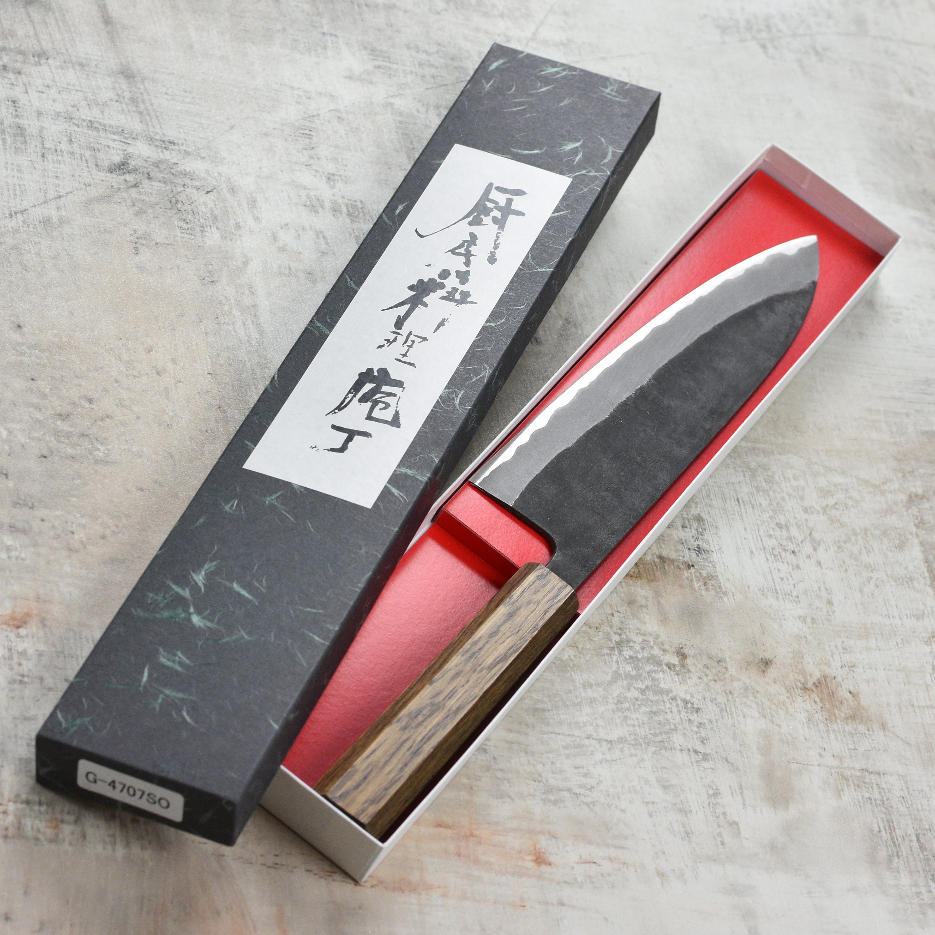 Close-up of the Shiro Kamo Aogami Super Gyutos sharp stainless steel blade, highlighting craftsmanship
