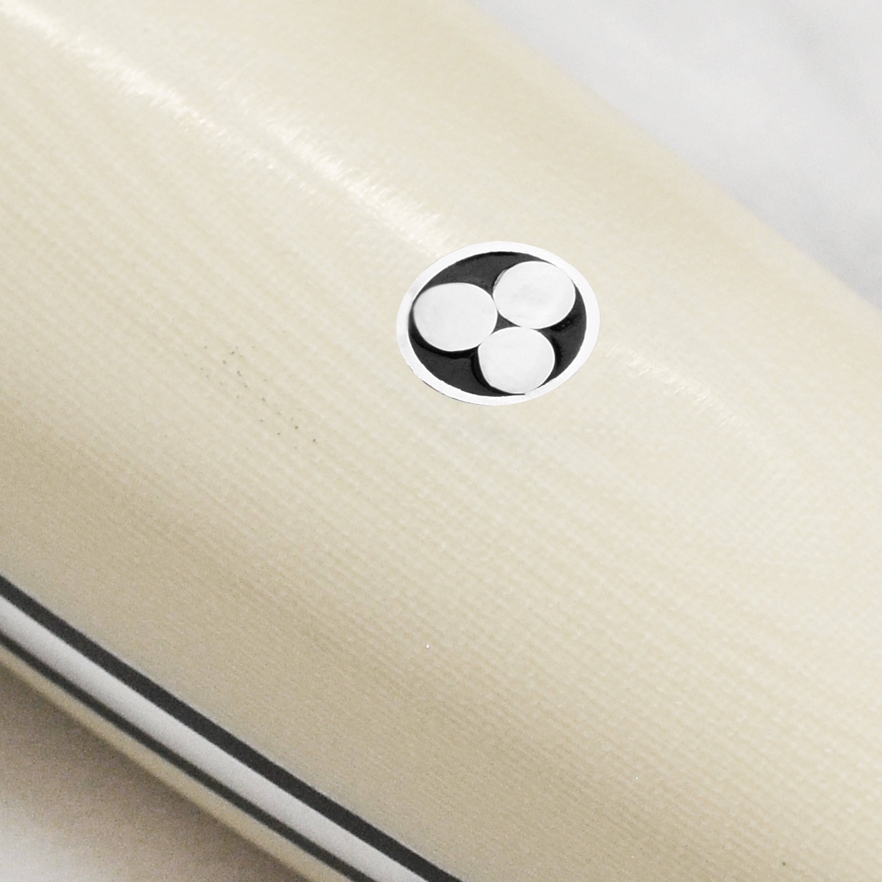 Close-up of the blade edge of the SG2 steel santoku knife, highlighting its sharpness and craftsmanship.