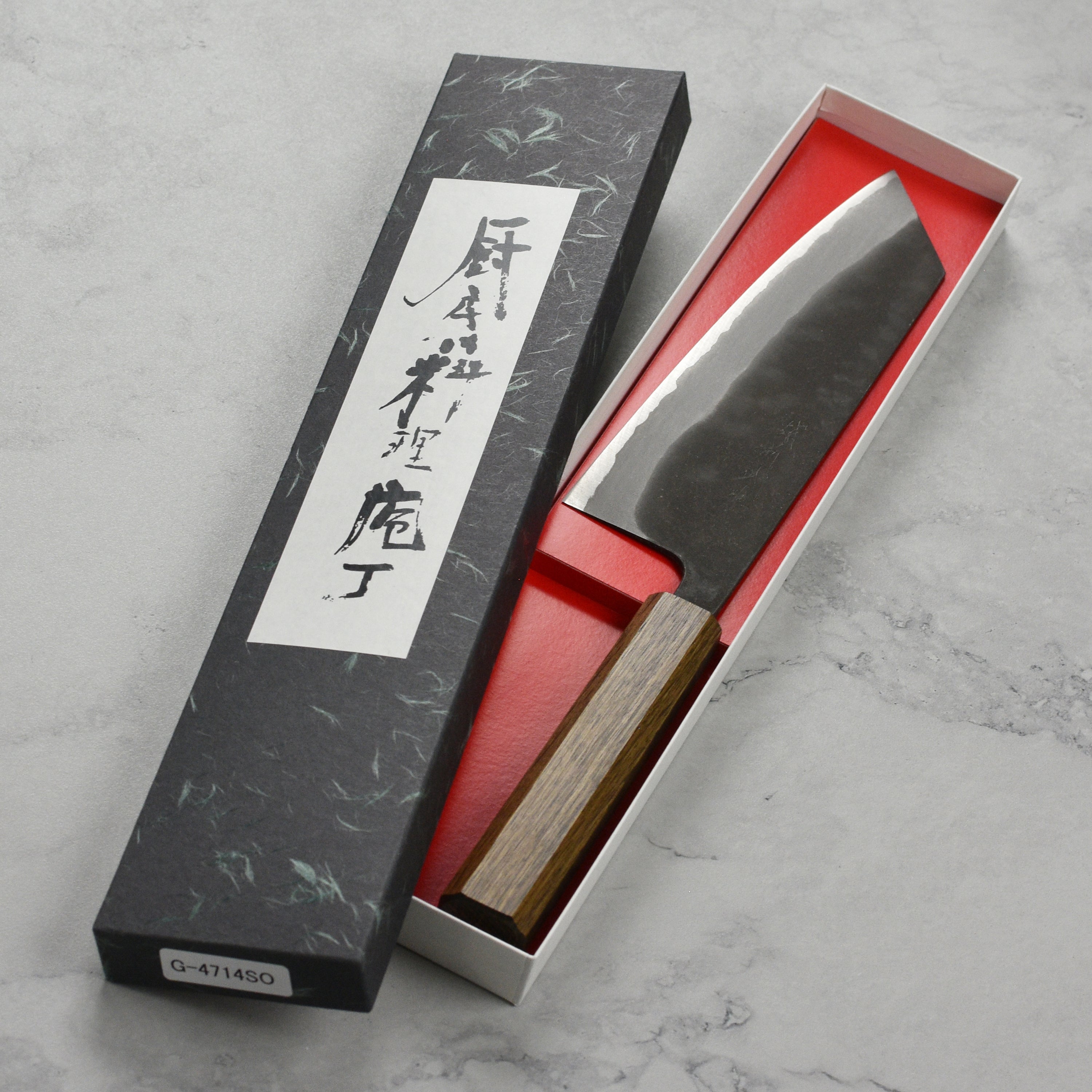 Close-up of Shiro Kamo Aogami Bunka knife blade highlighting its sharpness and craftsmanship.