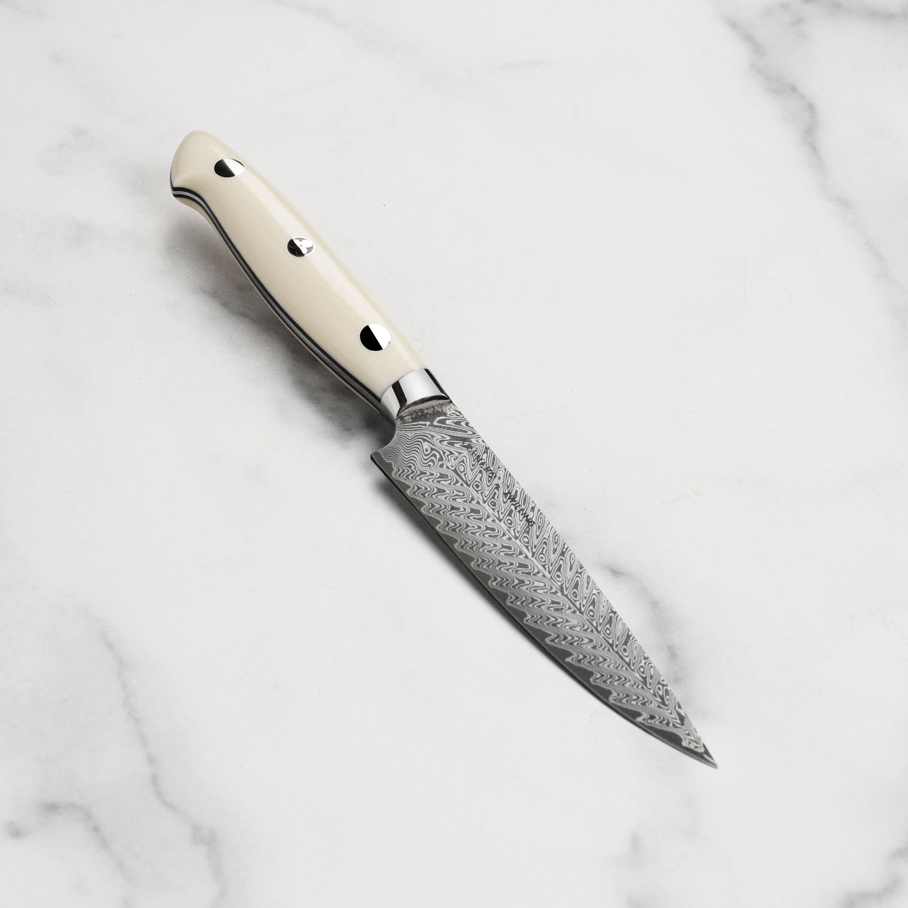 Kramer Cumulus Damascus utility knife with layered blade and ergonomic handle