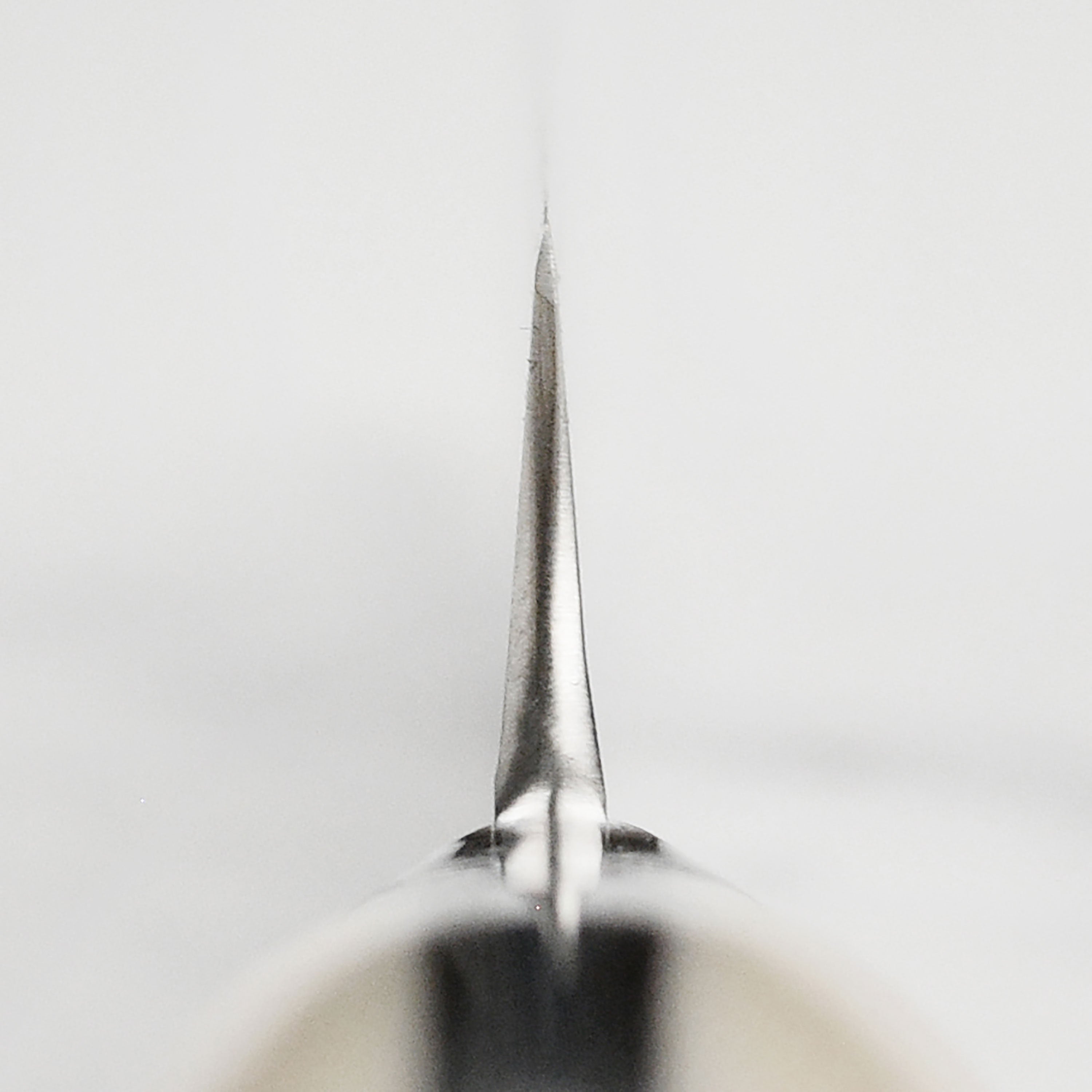 Japanese knife featuring 101-layer Damascus steel with chevron pattern for precision cutting