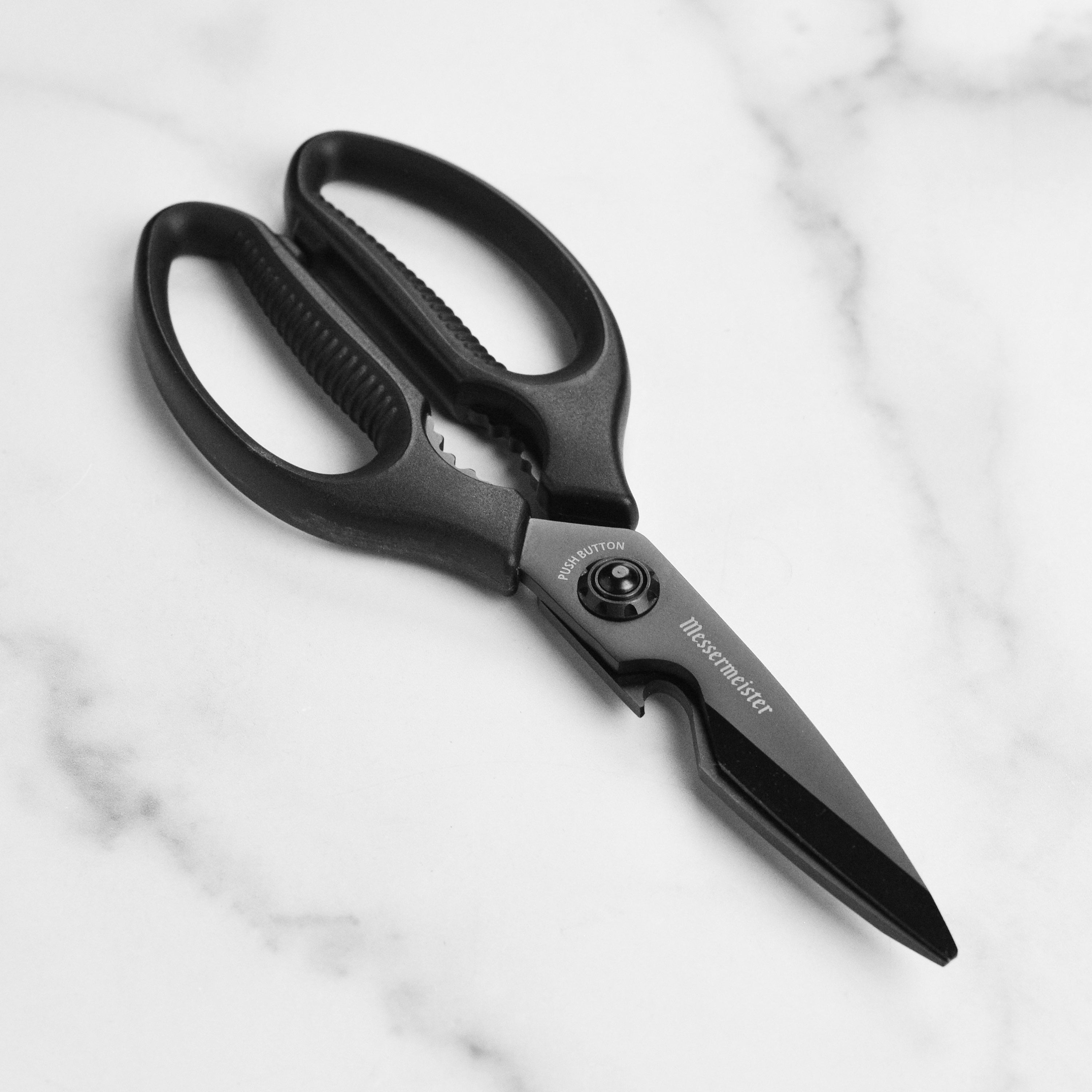 Titan shears in use as a bottle opener during a weekend barbecue