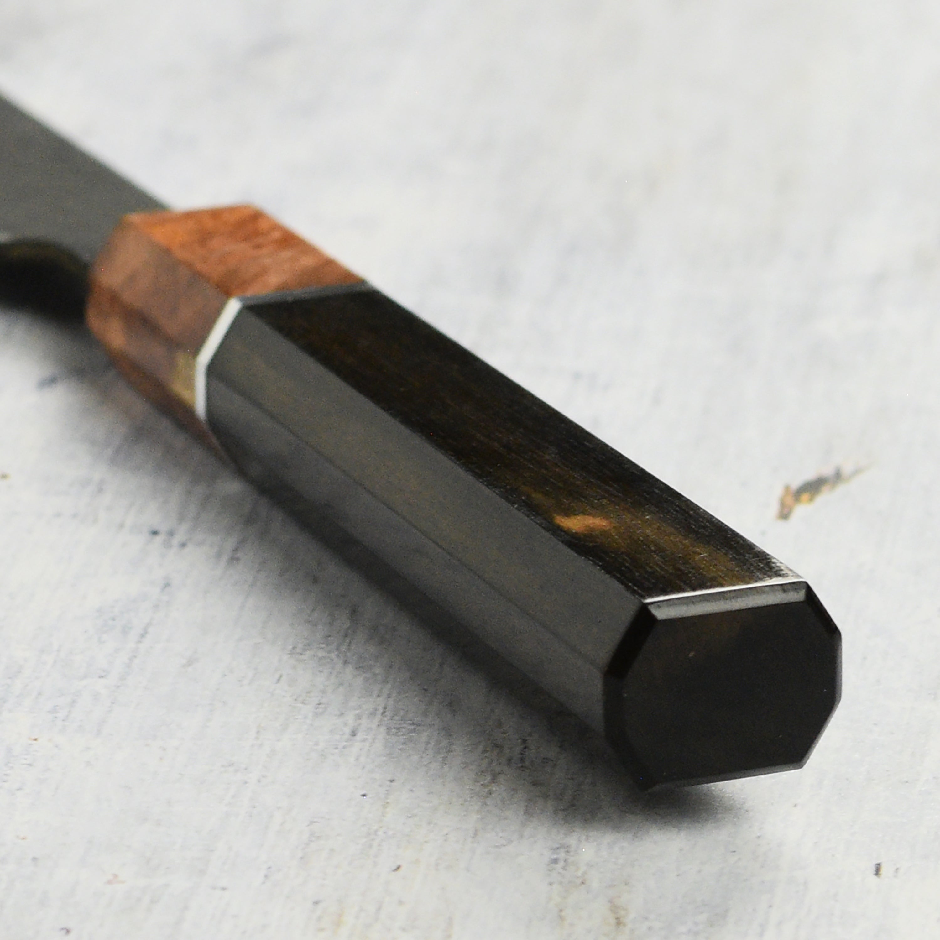 Hinoura Damascus knife highlighting its blade design and craftsmanship