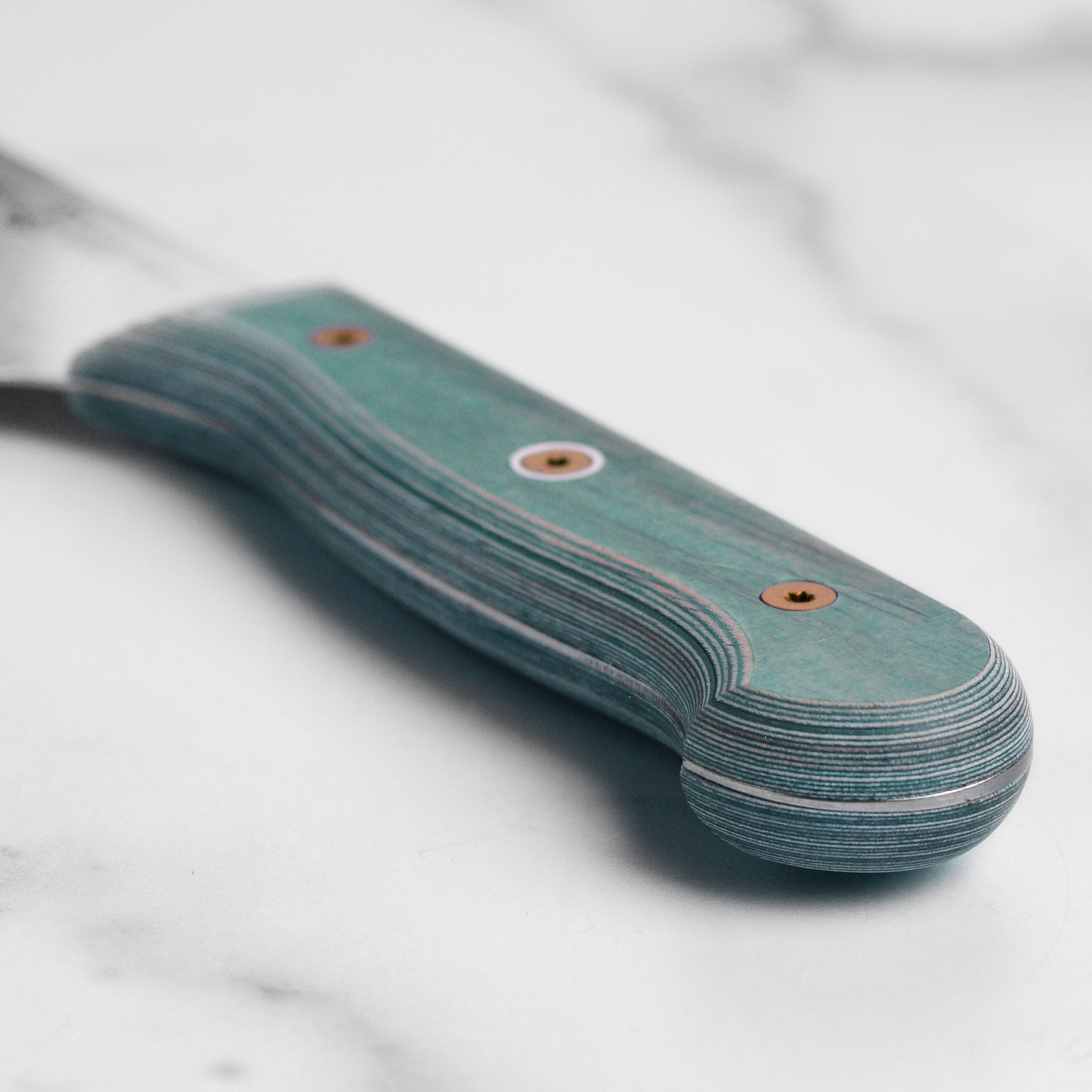 Ergonomic Pakkawood handle on the 8-inch kitchen knife for comfortable grip