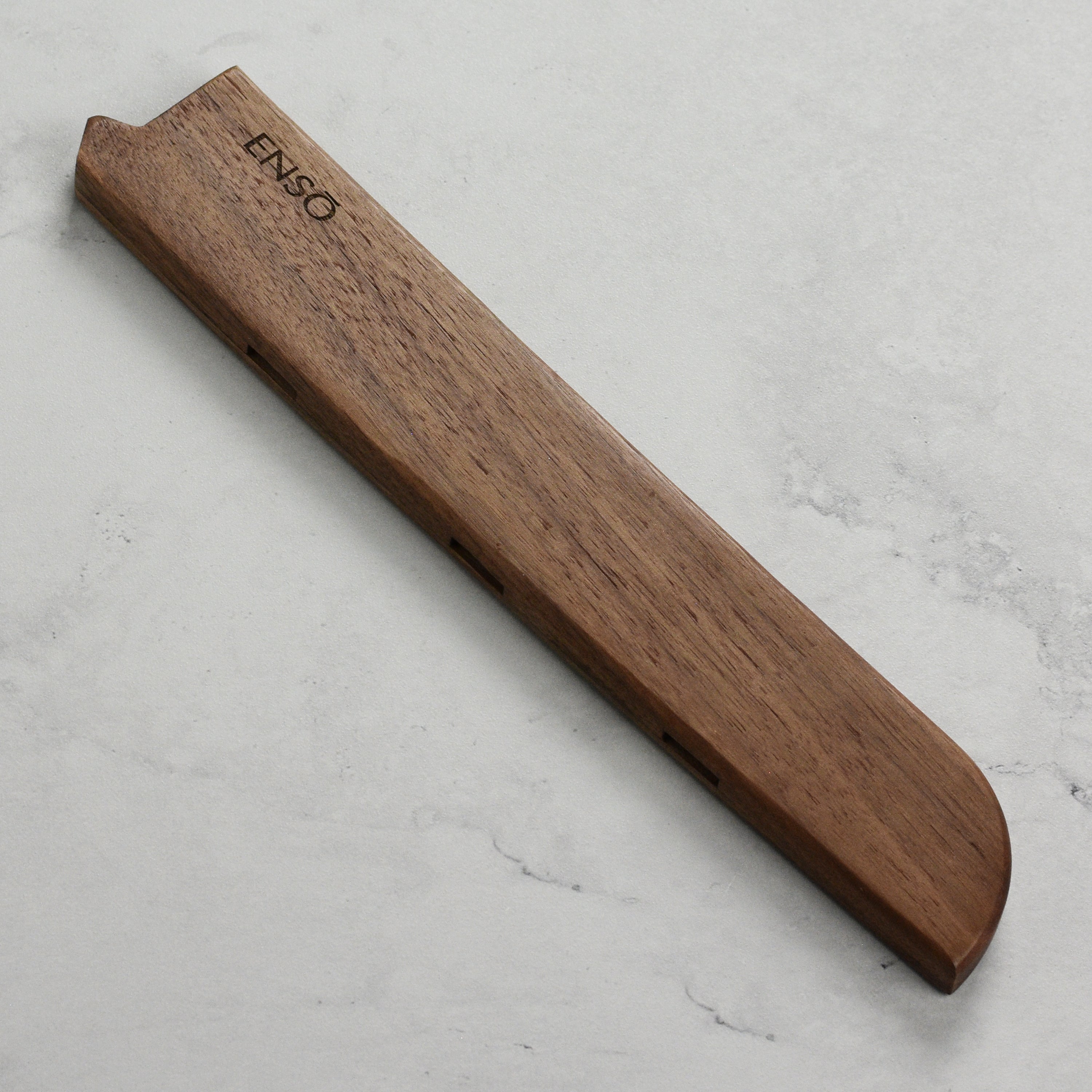 Close-up of Enso walnut magnetic knife sheath showcasing durability and design.