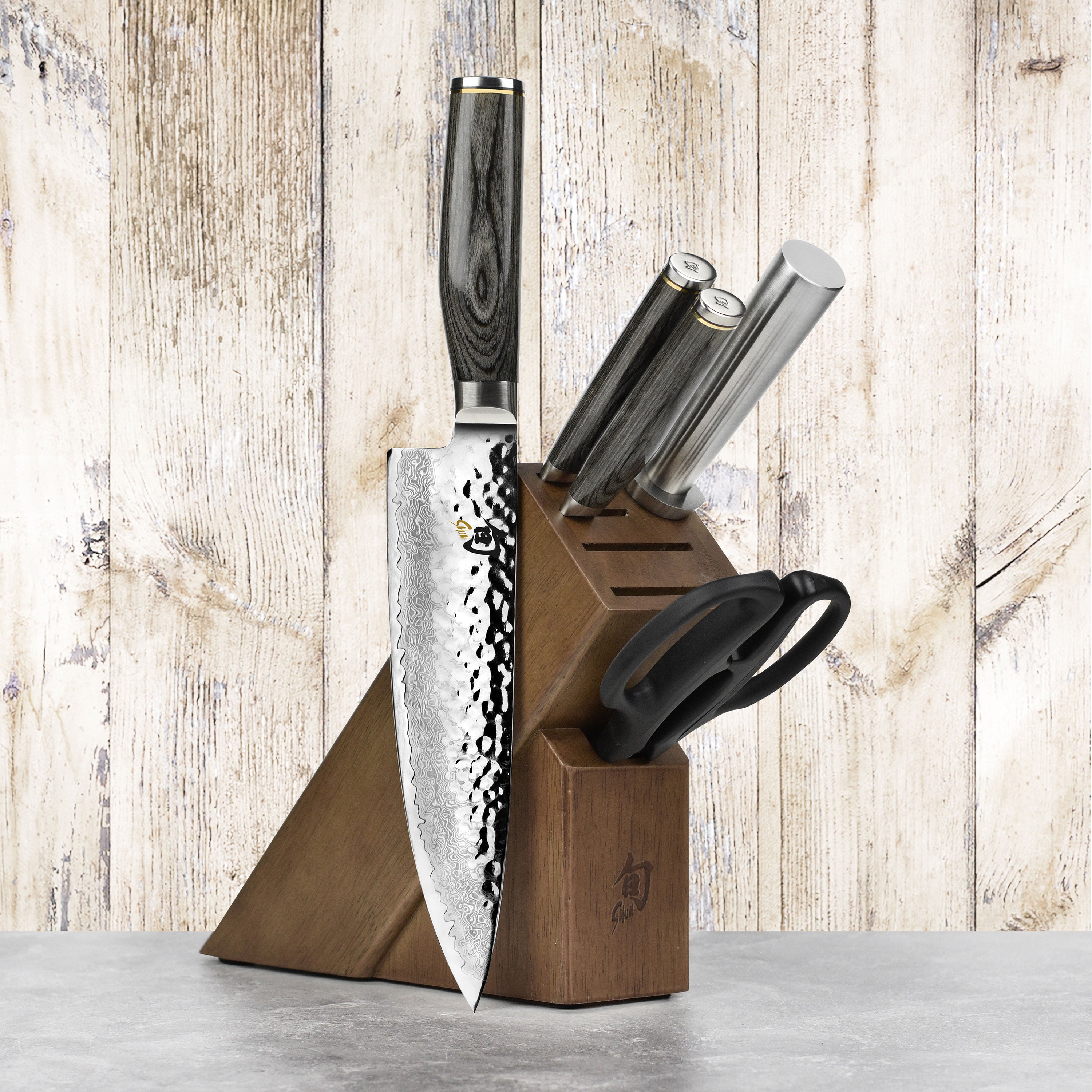 Angled top view showing the hammered Tsuchime finish on the chef knife from the Shun Premier knife block set
