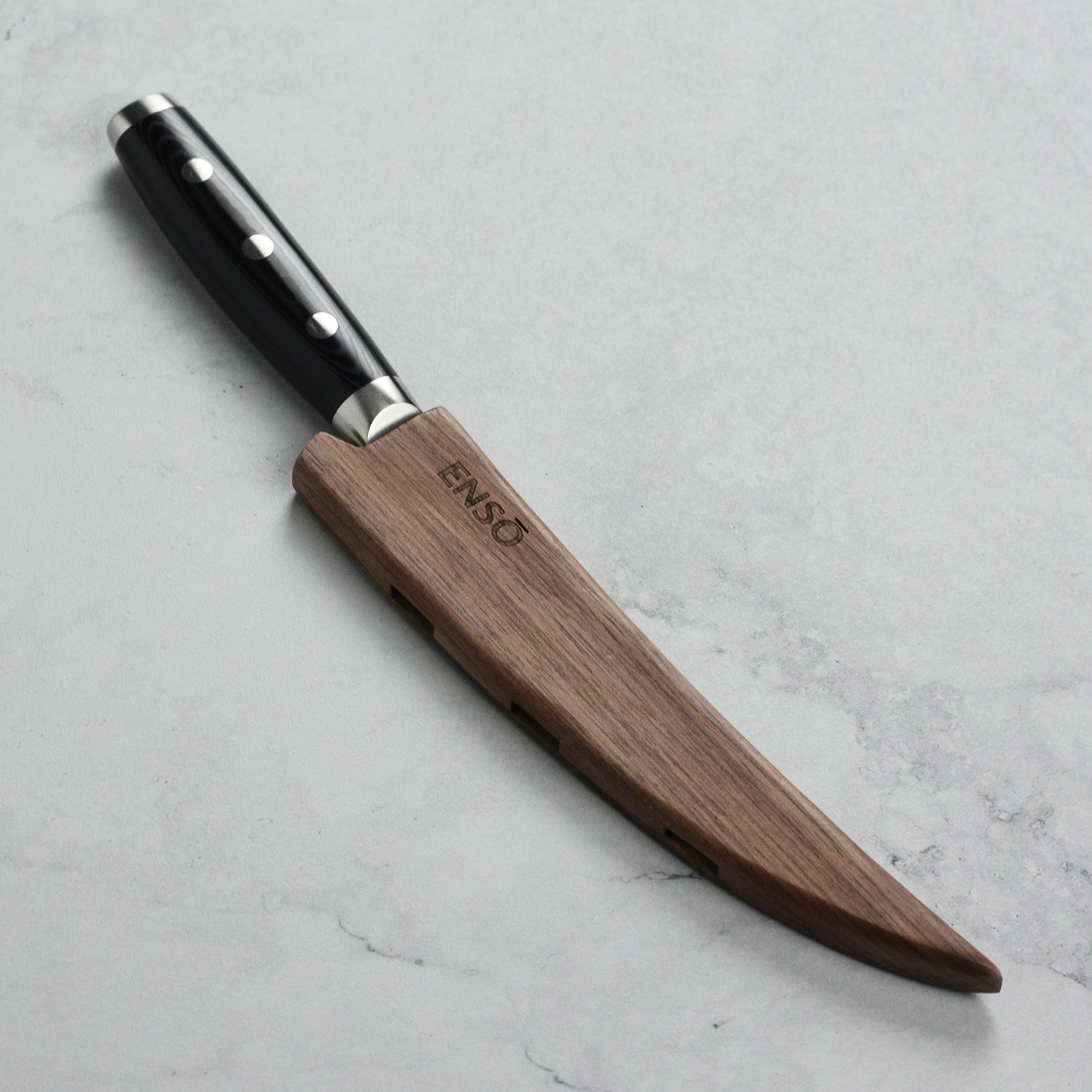 Close-up of magnetic sheath with knife inserted