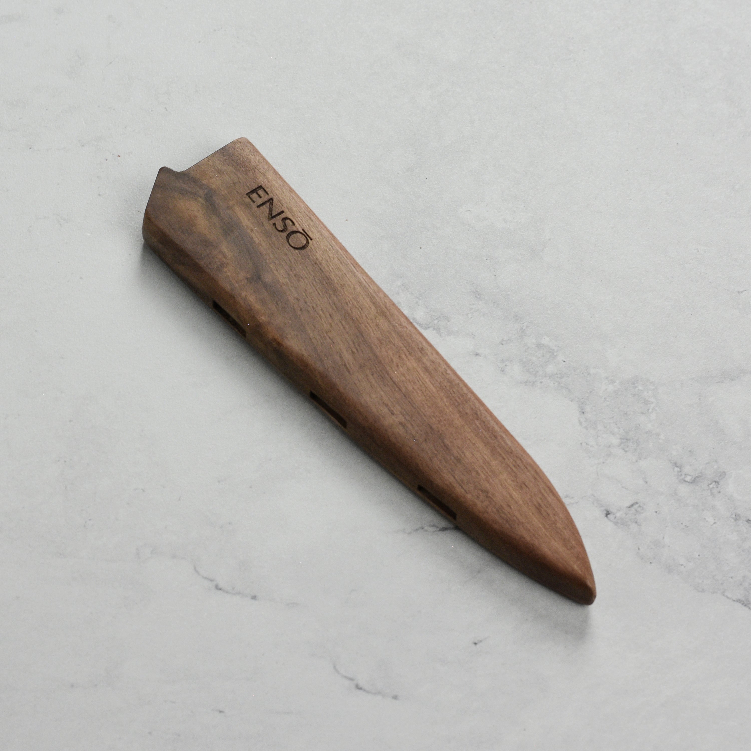Enso Walnut Magnetic Utility Knife Holder showcasing the beautiful grain of the wood and strong magnets.